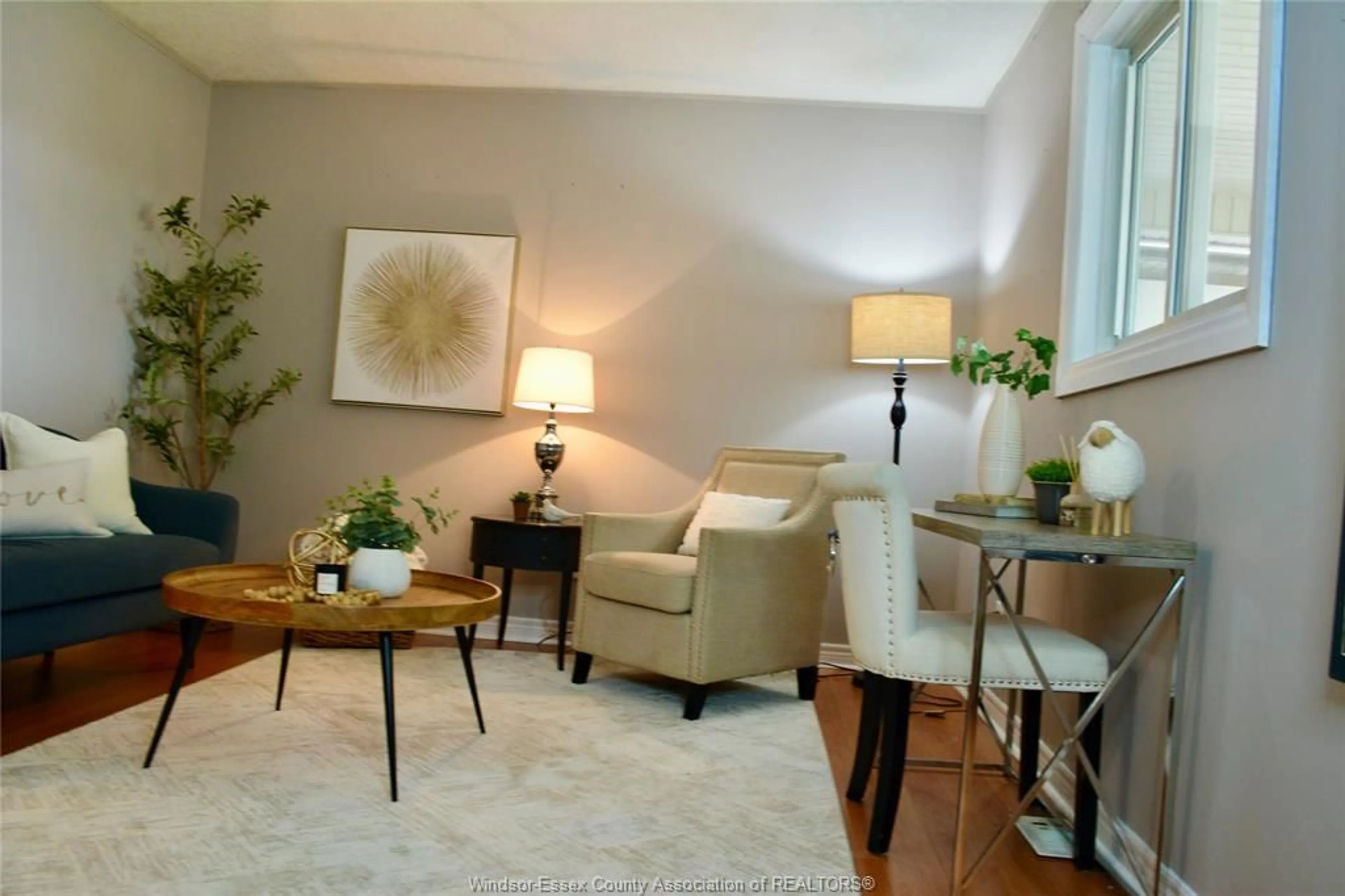 Living room with furniture, wood/laminate floor for 3017 TURNER Rd #1218, Windsor Ontario N8W 3L6