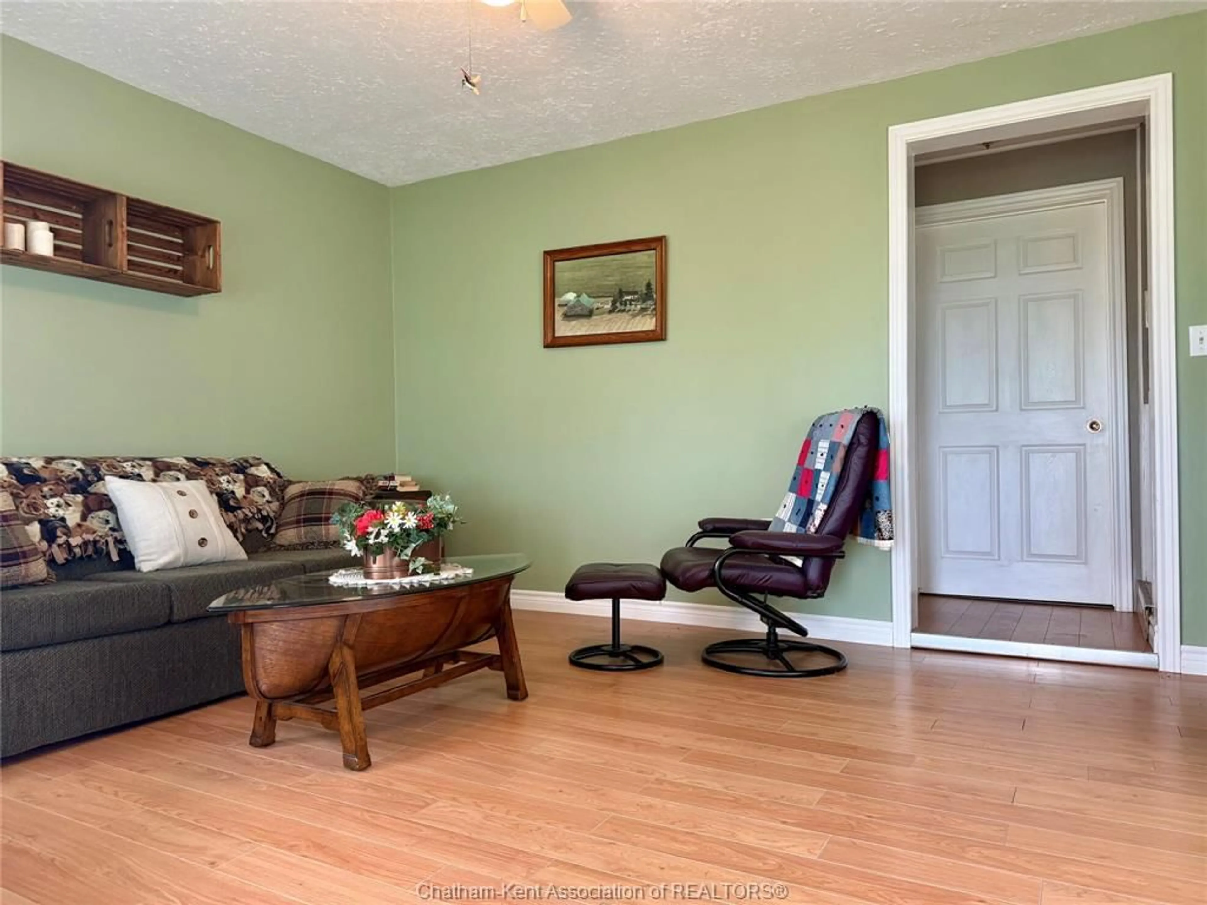 Living room with furniture, wood/laminate floor for 19961 KENT BRIDGE Rd, Blenheim Ontario N0P 1A0