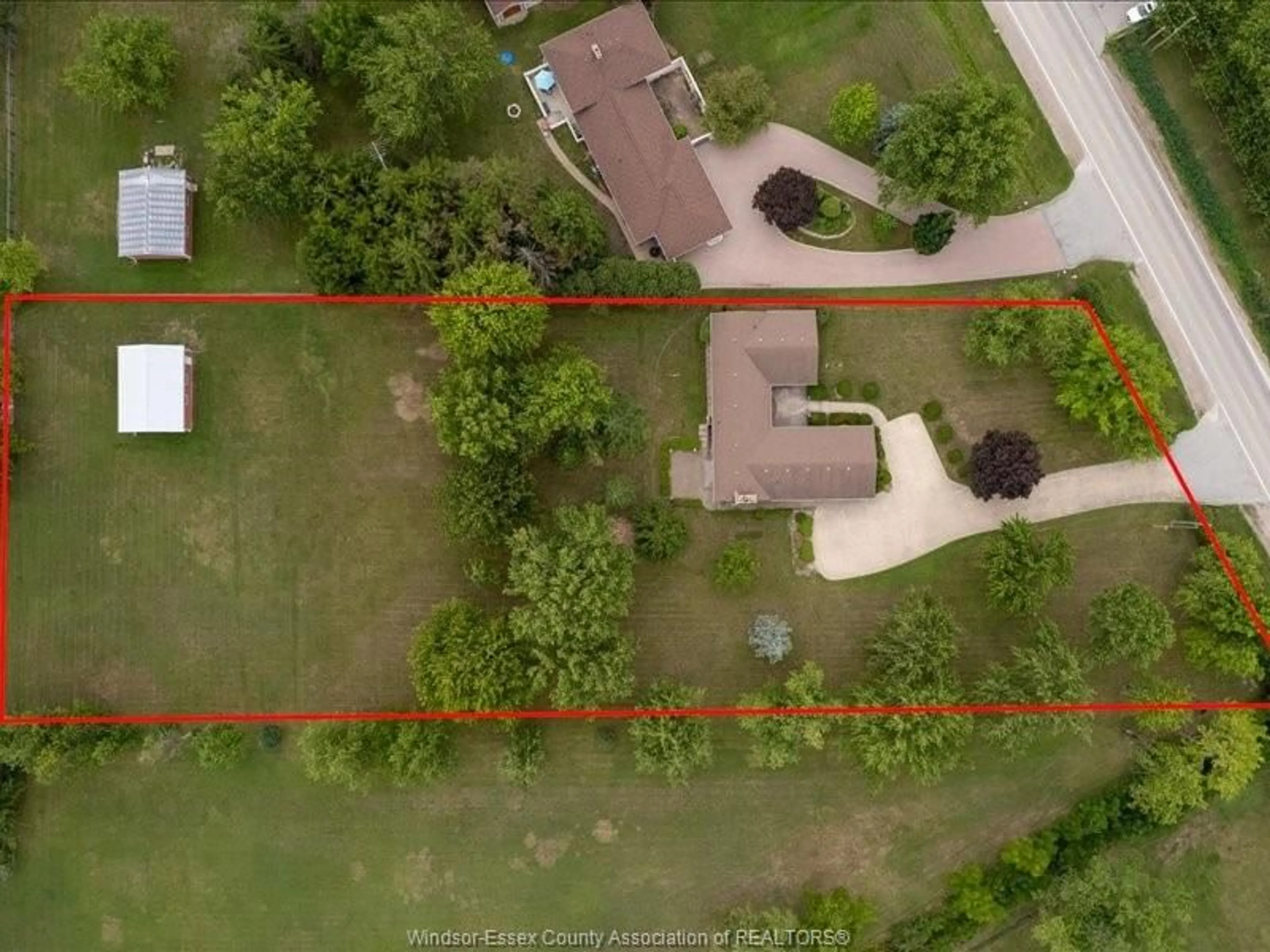 A pic from outside/outdoor area/front of a property/back of a property/a pic from drone, street for 6360 Huron Church, LaSalle Ontario N9H 0J7
