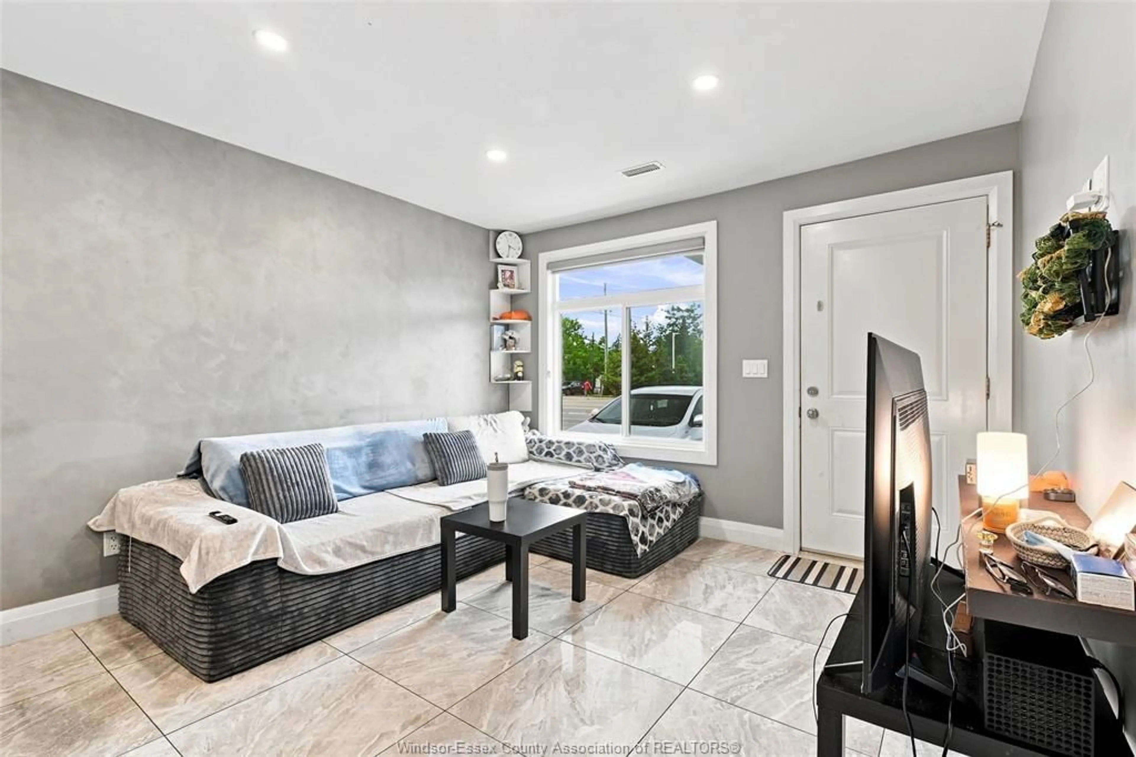 Living room with furniture, ceramic/tile floor for 3457 WALKER Rd, Windsor Ontario N8W 3S2