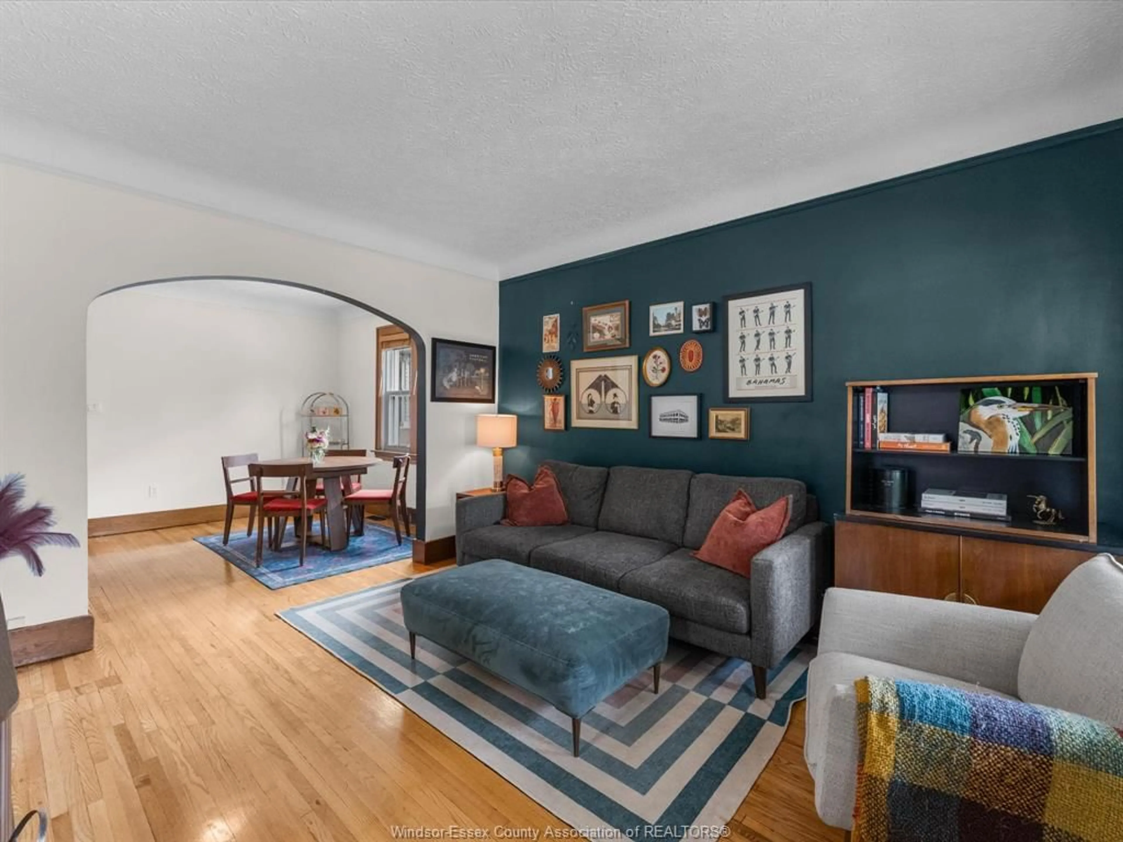 Living room with furniture, wood/laminate floor for 2220 LINCOLN Rd, Windsor Ontario N8W 2R2