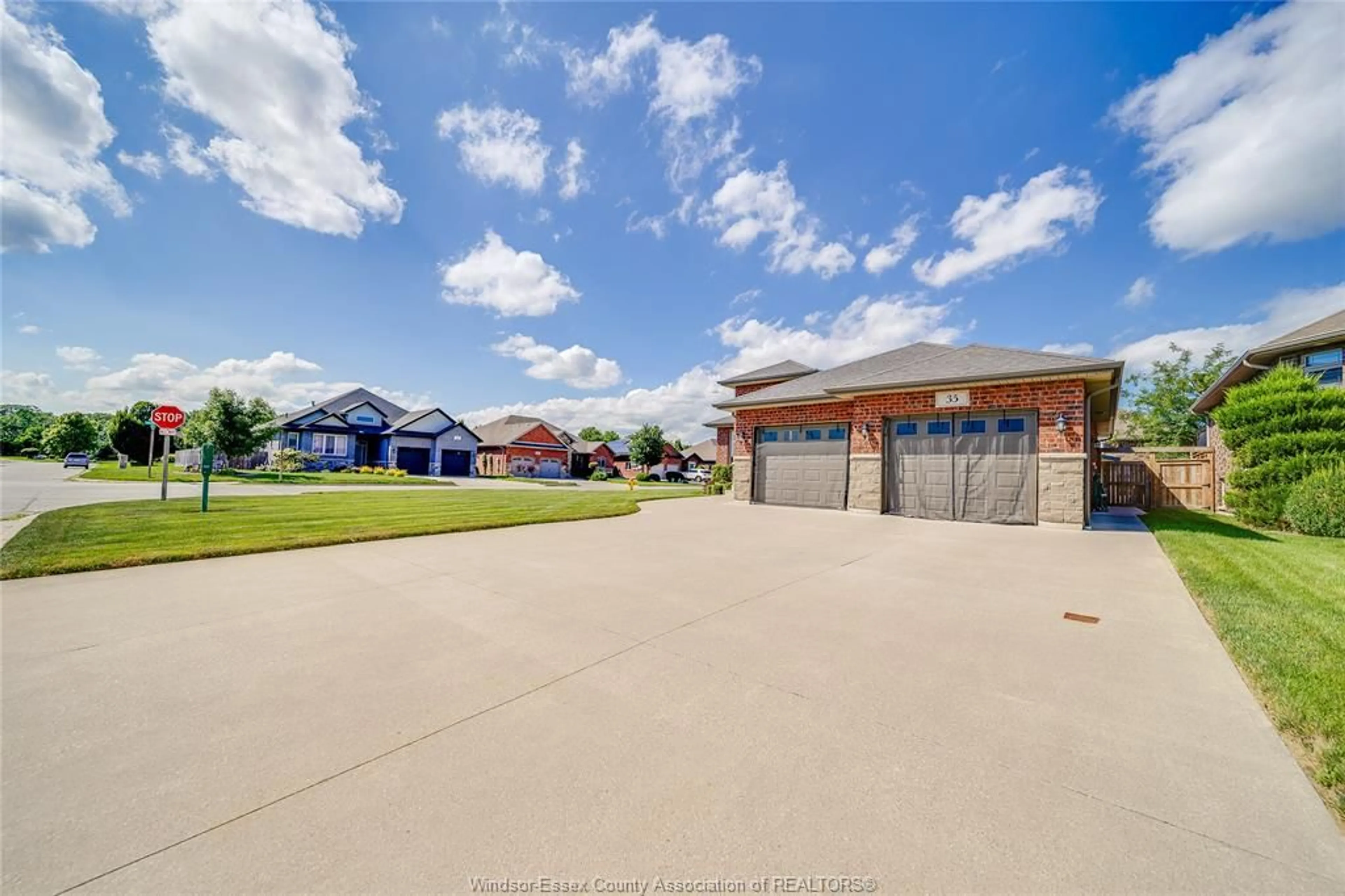A pic from outside/outdoor area/front of a property/back of a property/a pic from drone, water/lake/river/ocean view for 35 MARSHWOODS Blvd, Kingsville Ontario N9Y 0A7
