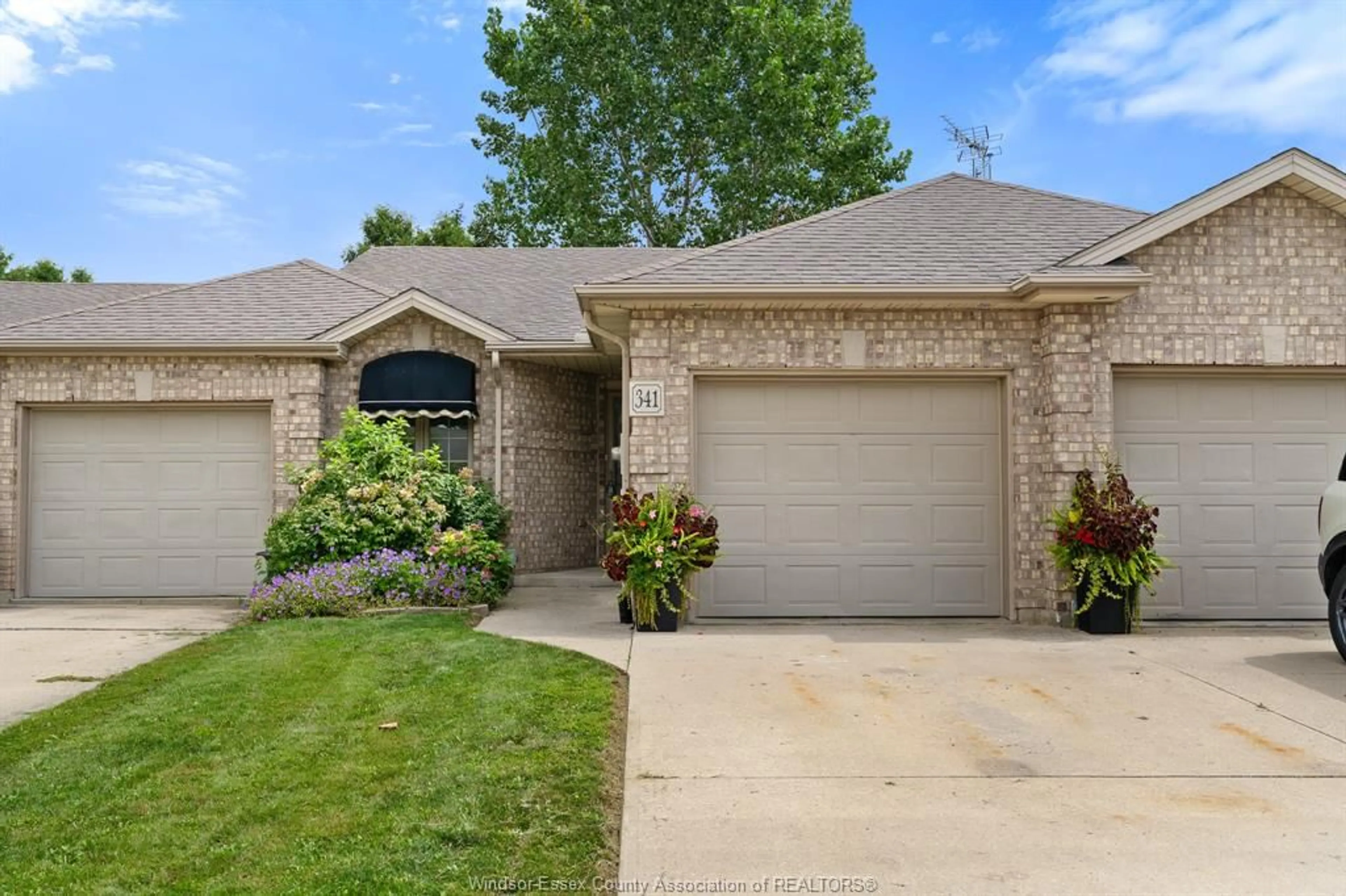 Home with brick exterior material, street for 341 Rockport Lane, Kingsville Ontario N9Y 4B3