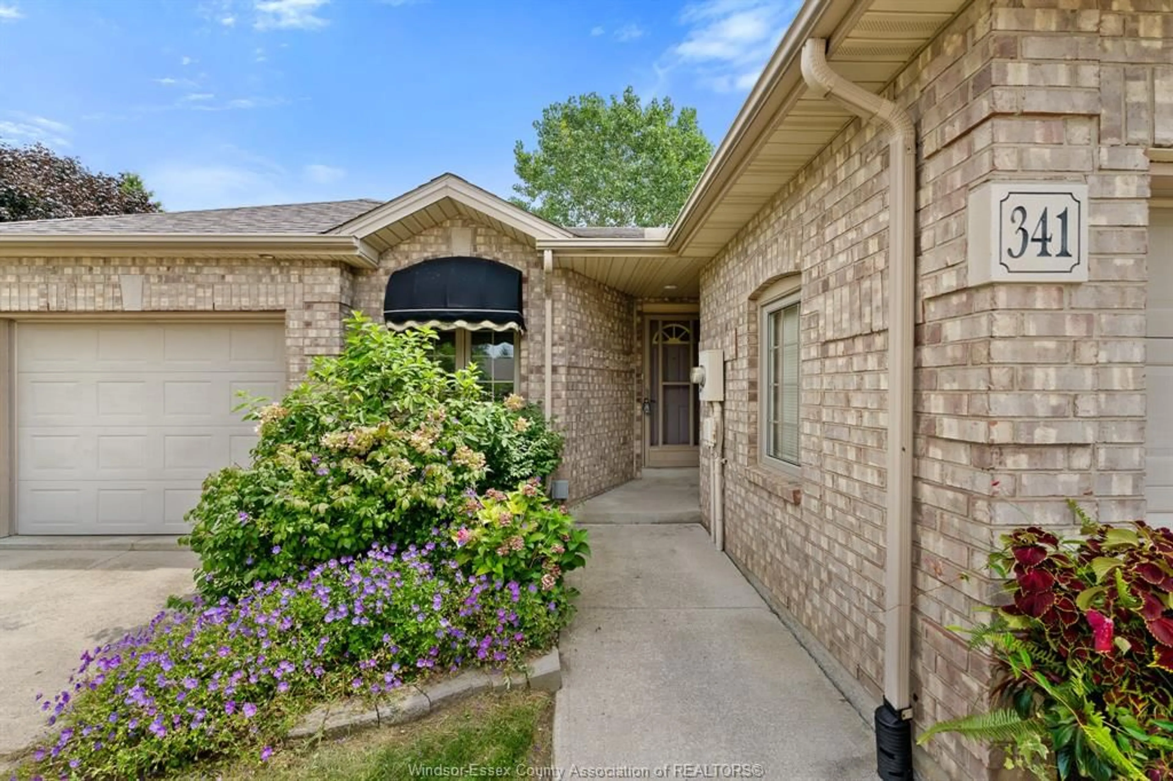Home with brick exterior material, street for 341 Rockport Lane, Kingsville Ontario N9Y 4B3