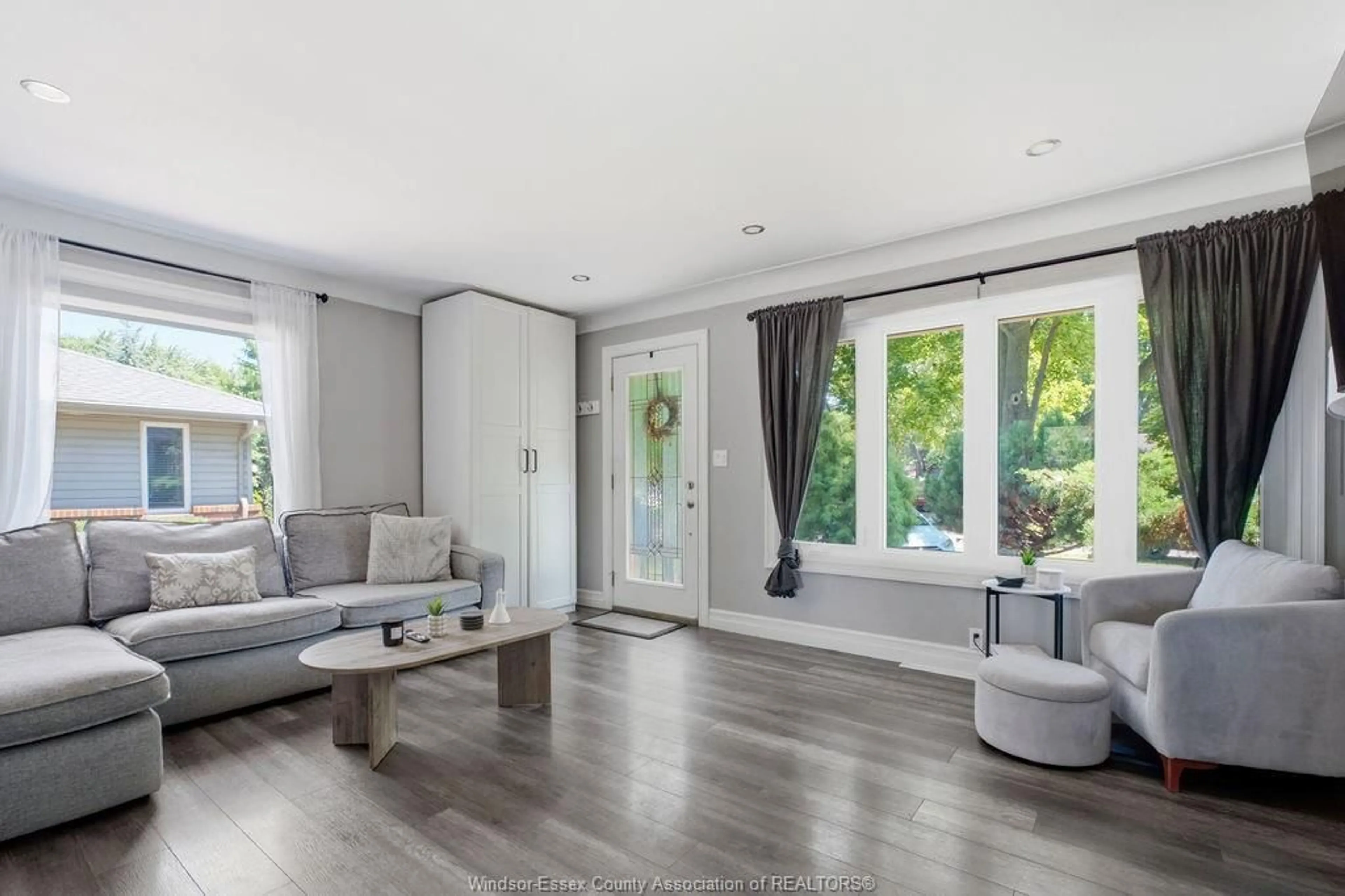 Living room with furniture, wood/laminate floor for 251 ST. MARKS Rd, Tecumseh Ontario N8N 2H6