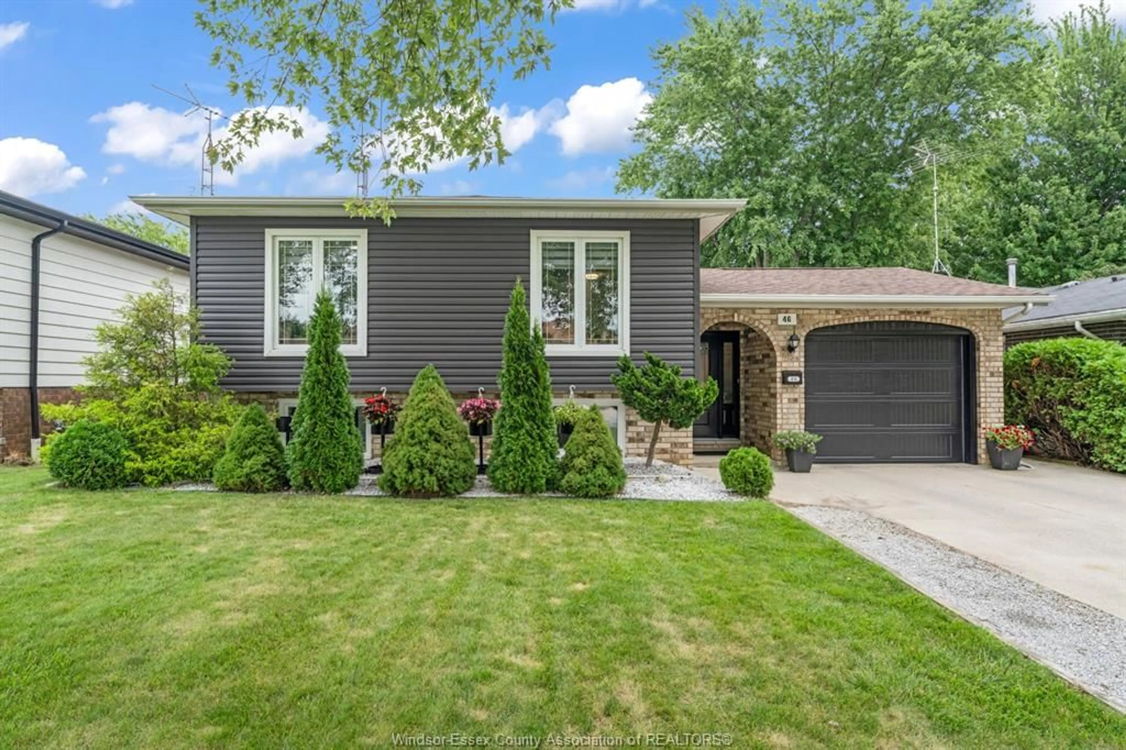 Home with vinyl exterior material, street for 46 Plumbrook Dr, Leamington Ontario N8H 4K9