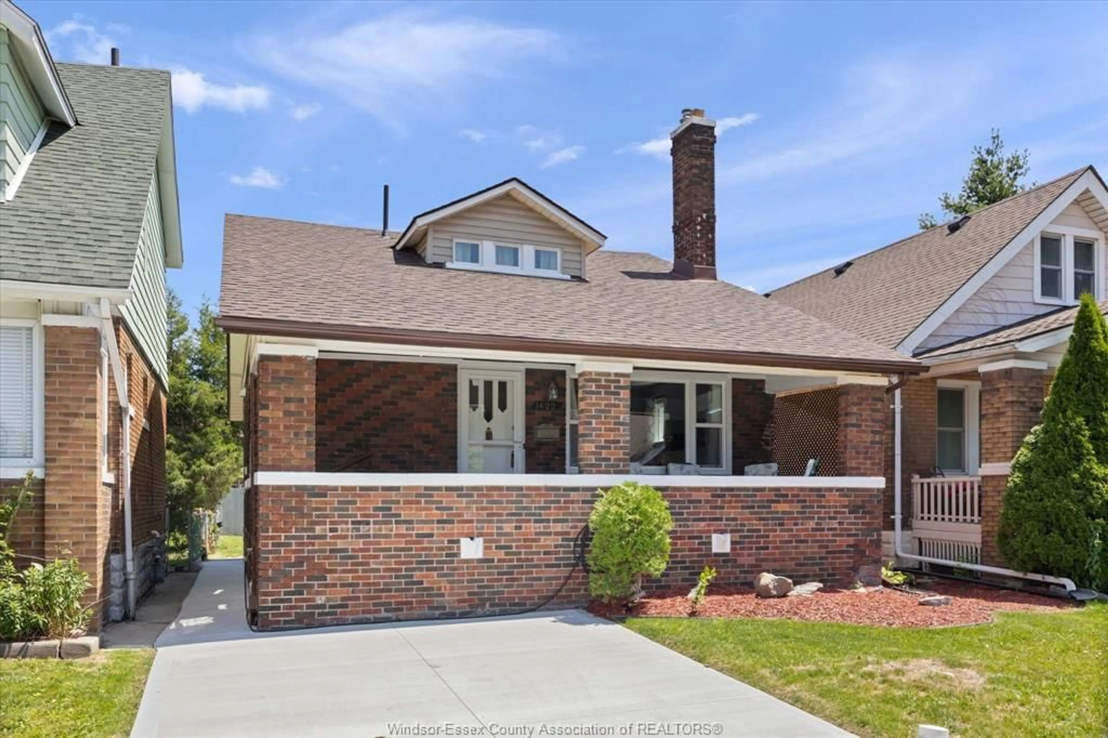 Home with brick exterior material, street for 1422 Elsmere Ave, Windsor Ontario N8X 4G9