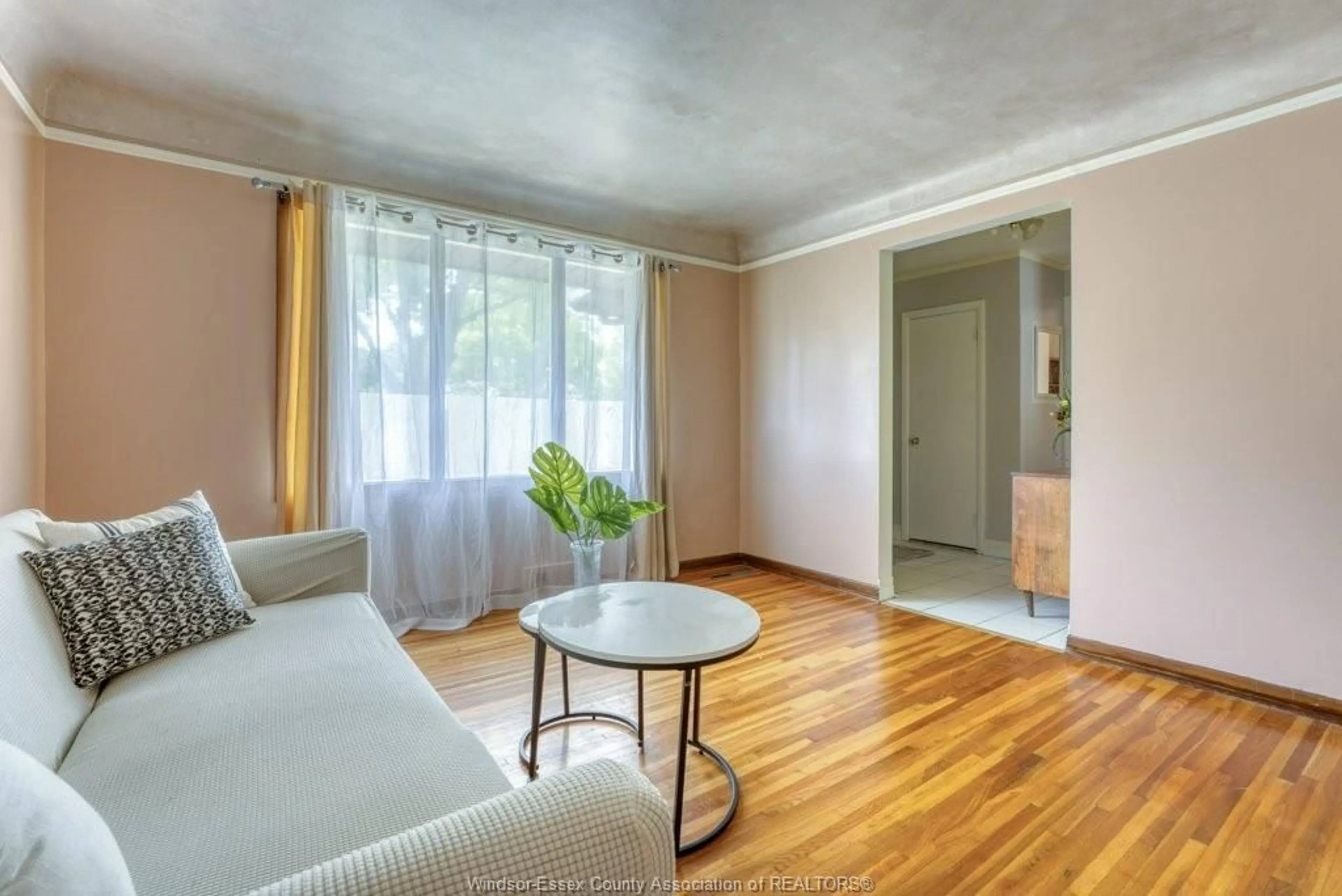 Living room with furniture, wood/laminate floor for 3277 DOMINION, Windsor Ontario N9E 2N6