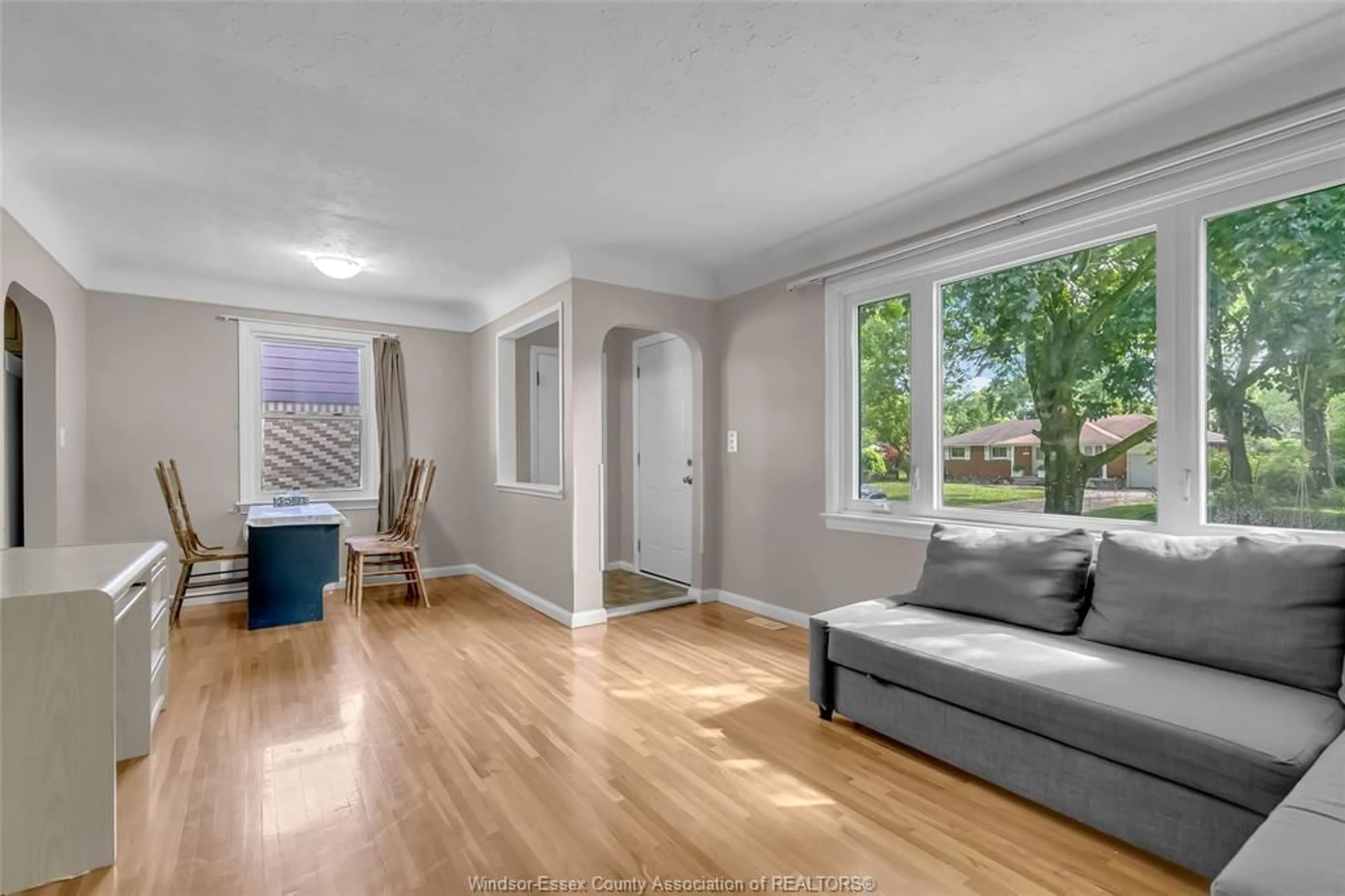 Living room with furniture, wood/laminate floor for 3331 LONGFELLOW, Windsor Ontario N9E 2L7