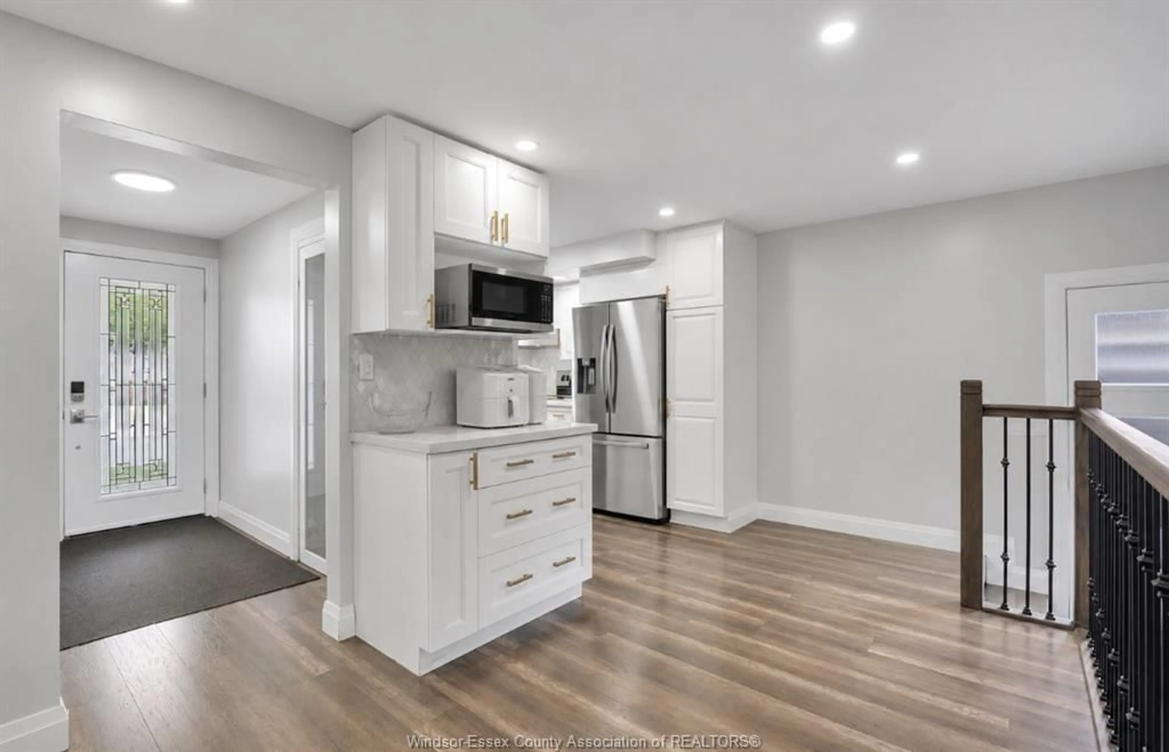 Open concept kitchen, wood/laminate floor for 9335 ESPLANADE, Windsor Ontario N8R 1J3