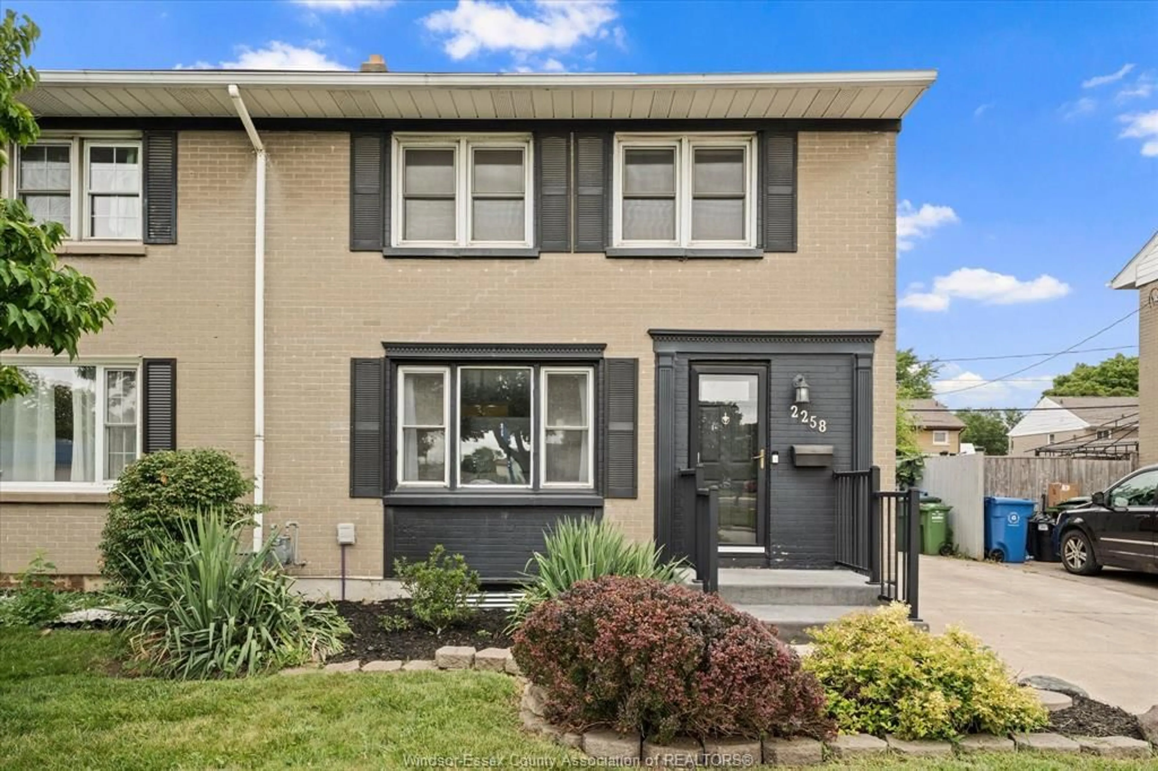 Home with vinyl exterior material, street for 2258 TECUMSEH Rd, Windsor Ontario N9B 1W1