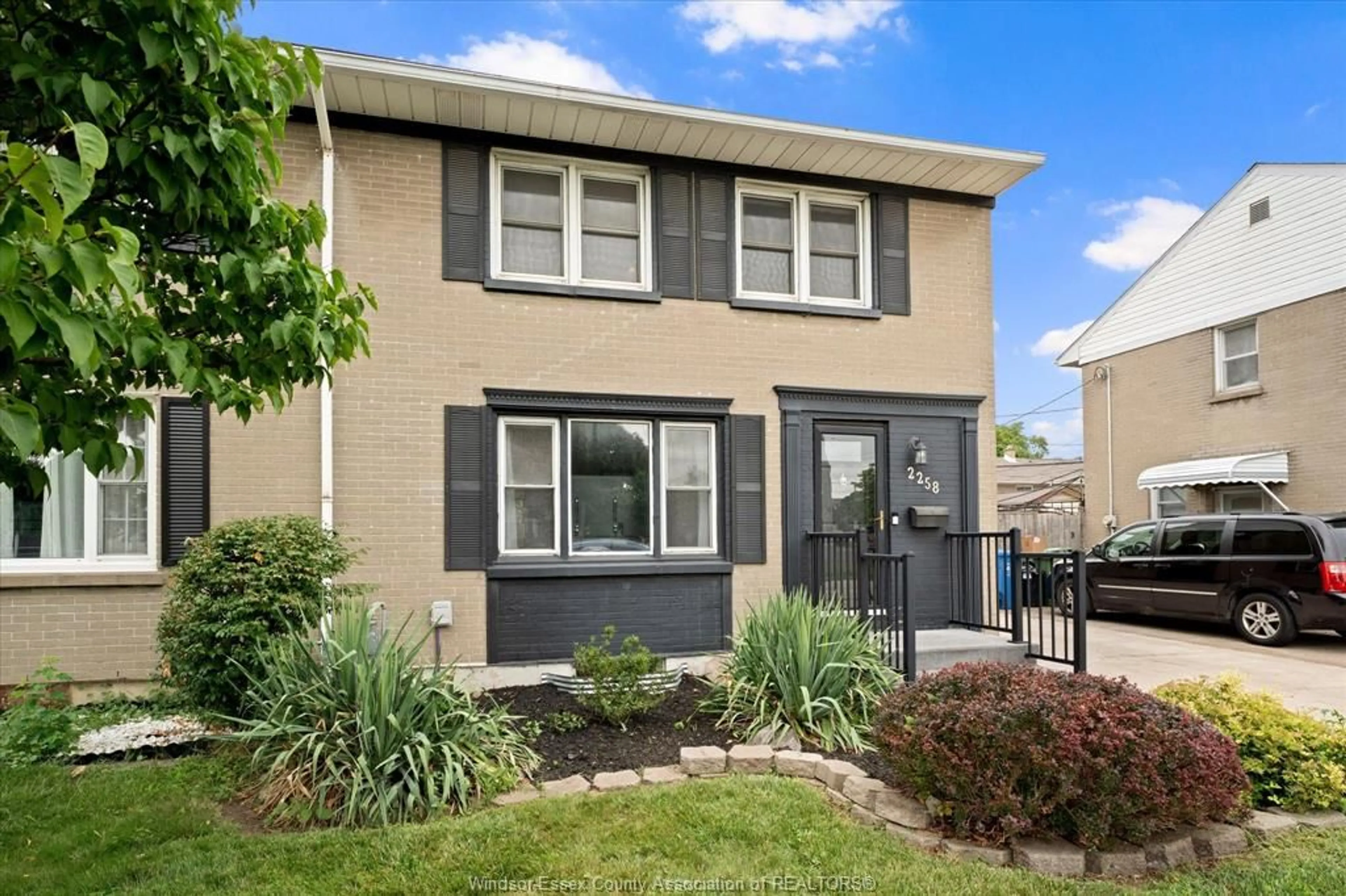 Home with vinyl exterior material, street for 2258 TECUMSEH Rd, Windsor Ontario N9B 1W1