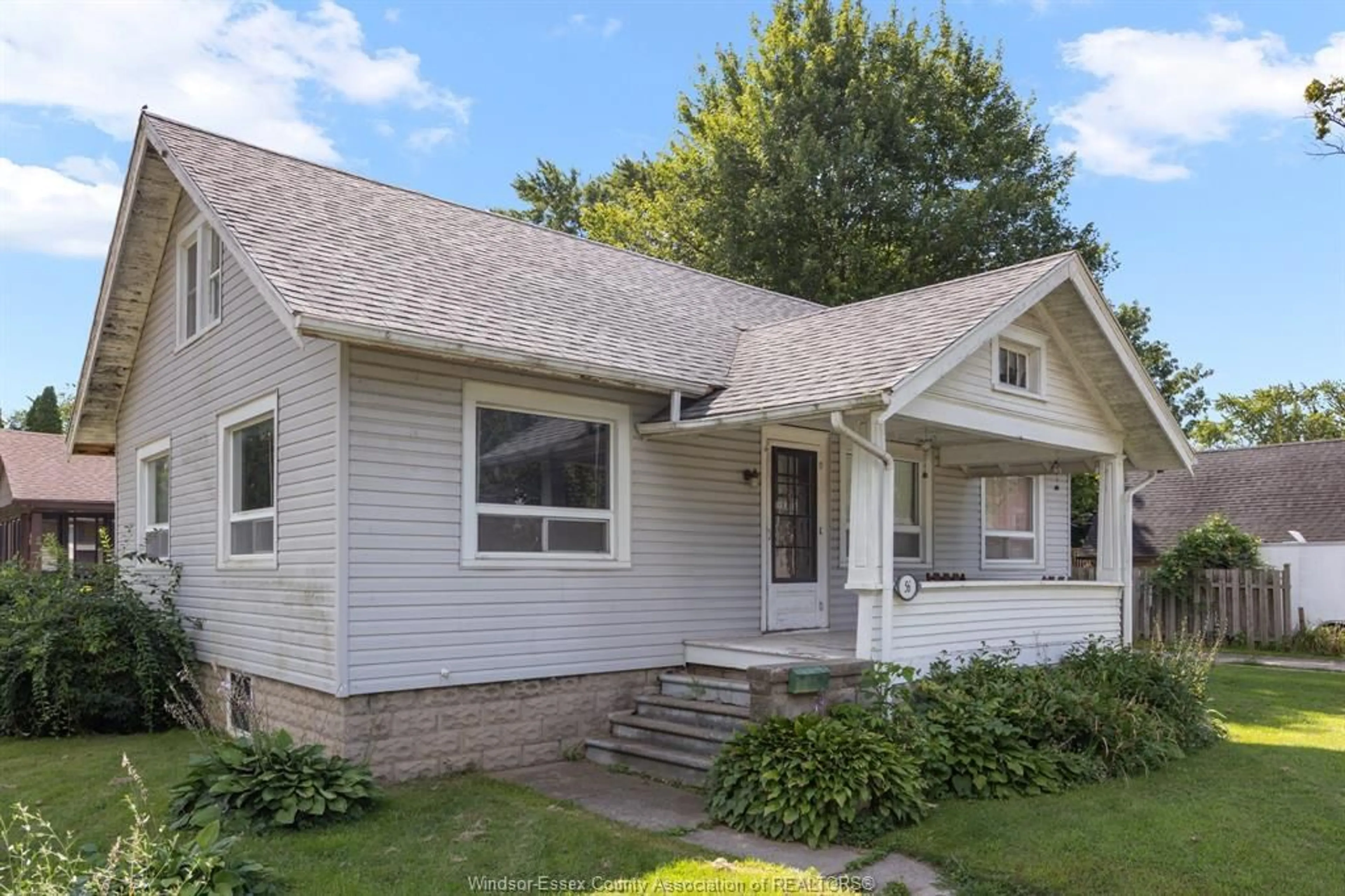 Home with vinyl exterior material, street for 56 WIGLE, Leamington Ontario N8H 2S9