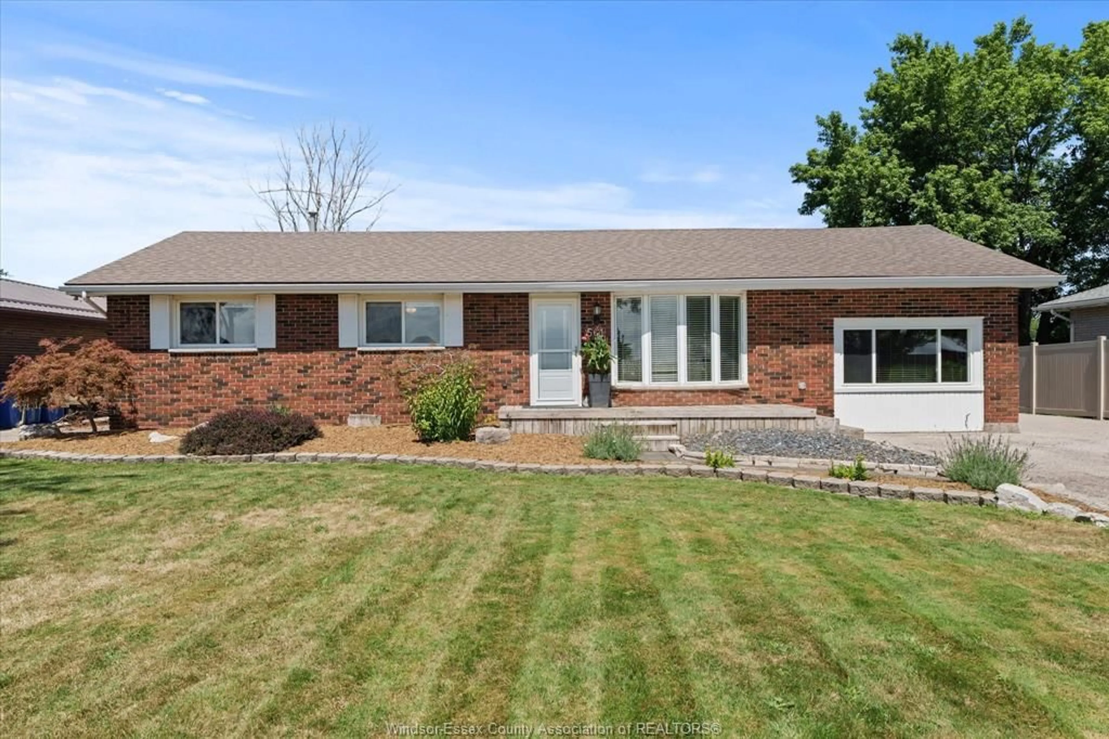 Home with brick exterior material, street for 561 COUNTY RD 2, Lakeshore Ontario N8L 1J9