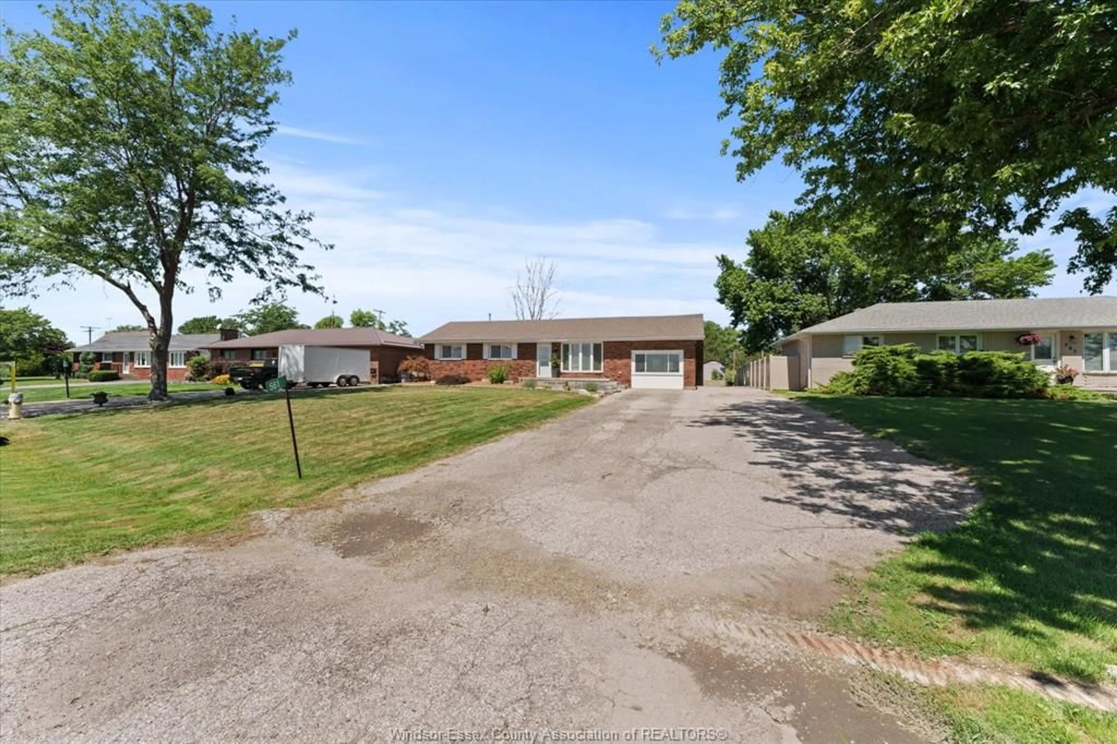A pic from outside/outdoor area/front of a property/back of a property/a pic from drone, street for 561 COUNTY RD 2, Lakeshore Ontario N8L 1J9