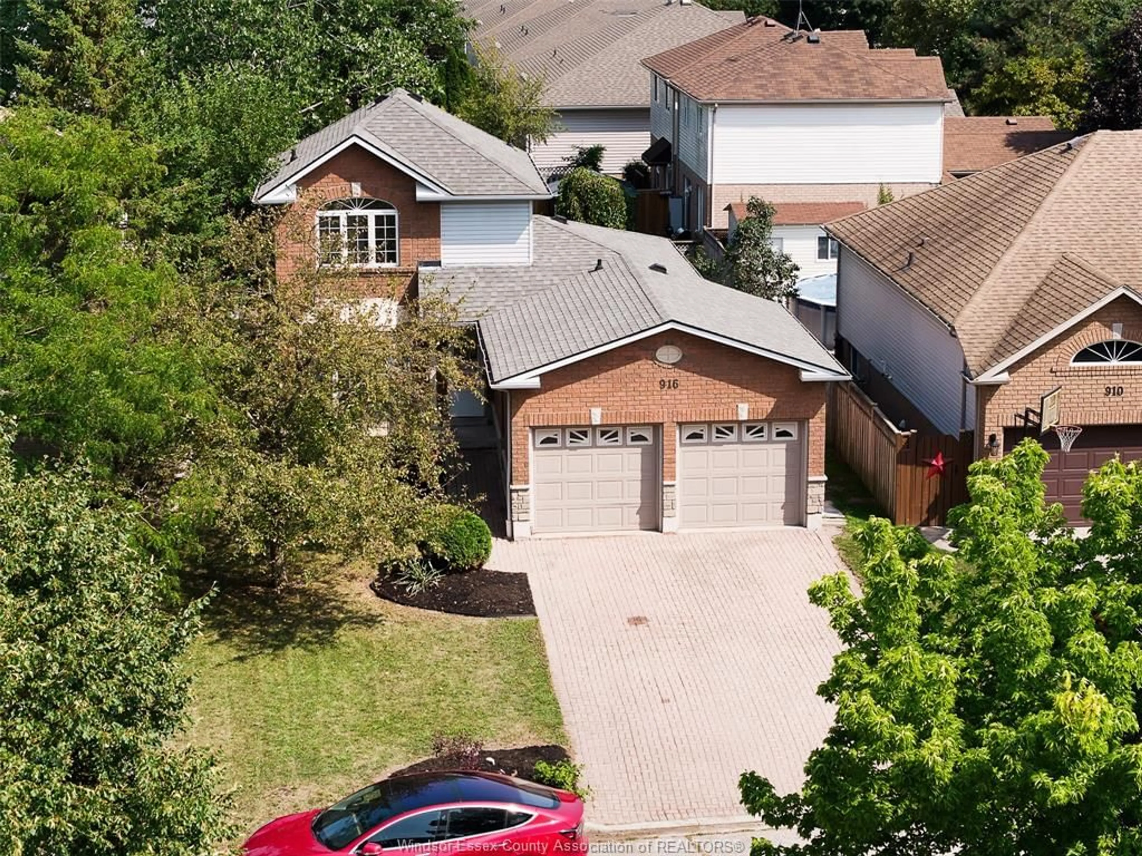 A pic from outside/outdoor area/front of a property/back of a property/a pic from drone, street for 916 Lemonwood, Windsor Ontario N9G 2R6