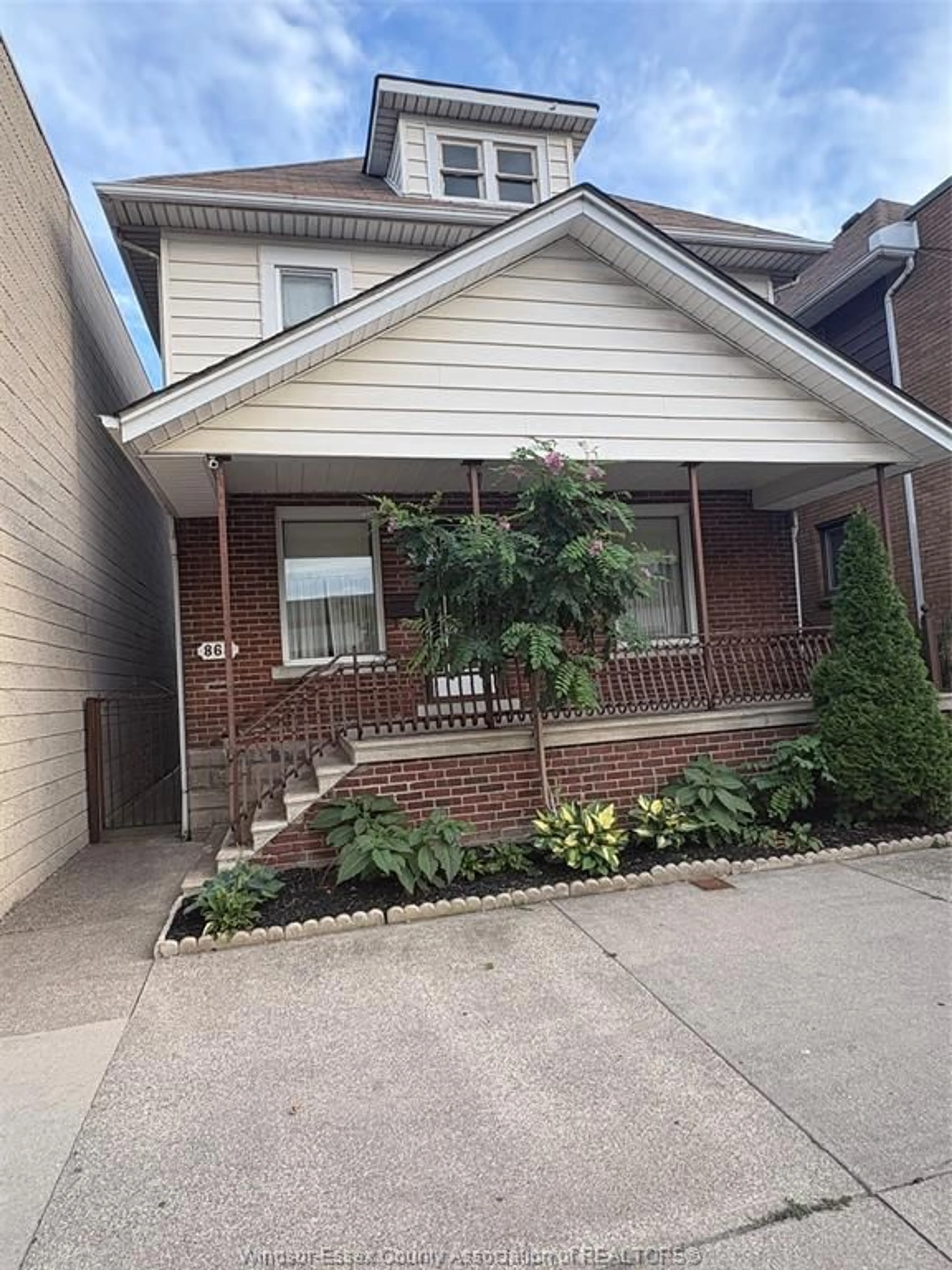 Home with brick exterior material, street for 865 ERIE St, Windsor Ontario N9A 3Y7