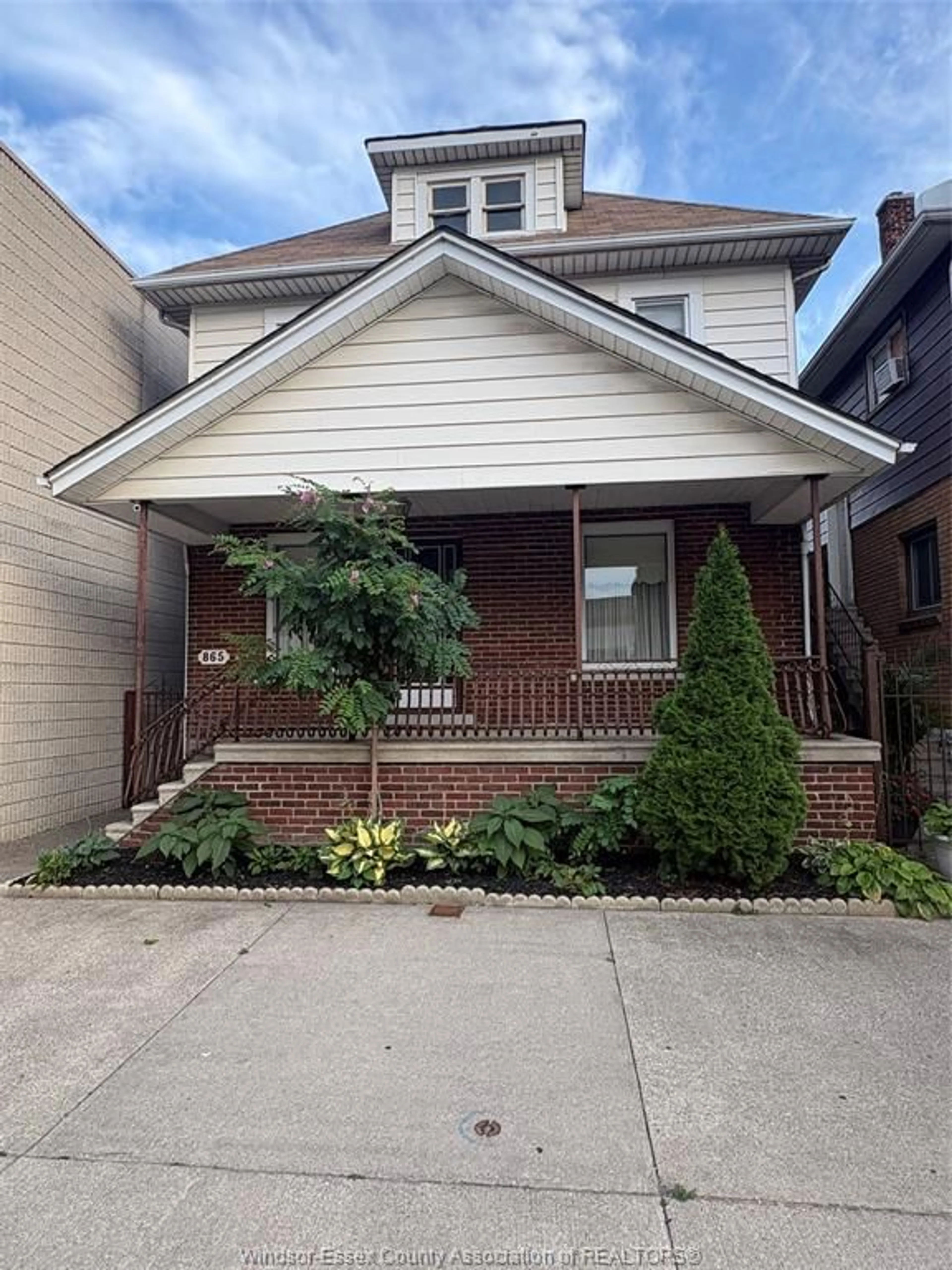 Home with brick exterior material, street for 865 ERIE St, Windsor Ontario N9A 3Y7