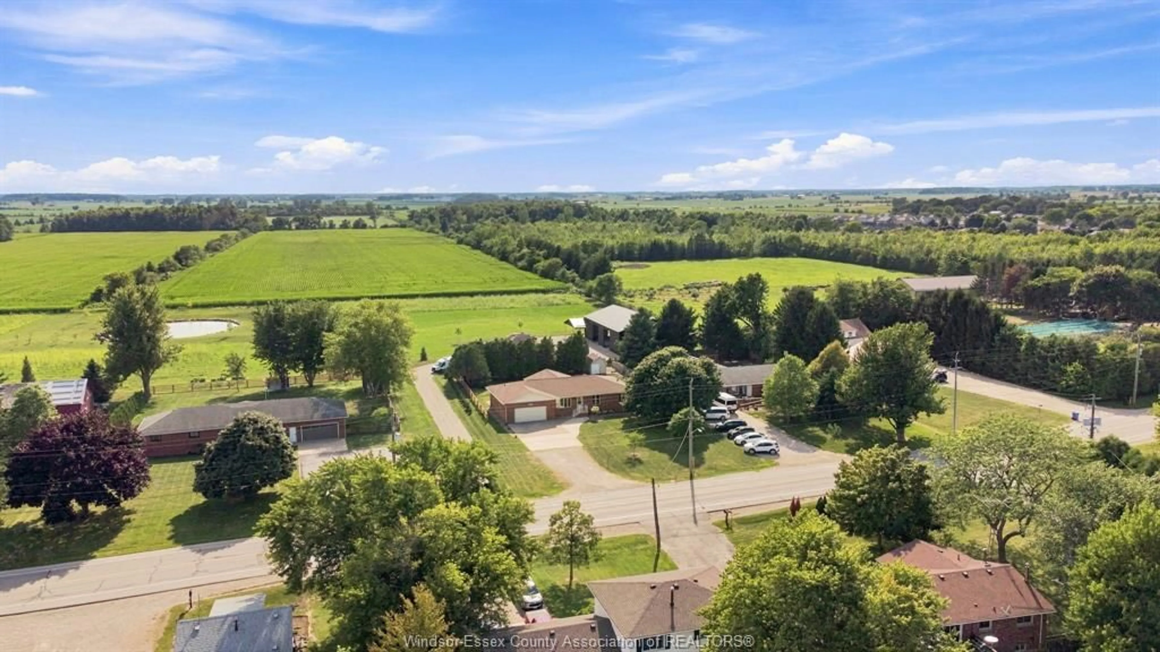 A pic from outside/outdoor area/front of a property/back of a property/a pic from drone, water/lake/river/ocean view for 164 COUNTY ROAD 34, Cottam Ontario N0R 1B0