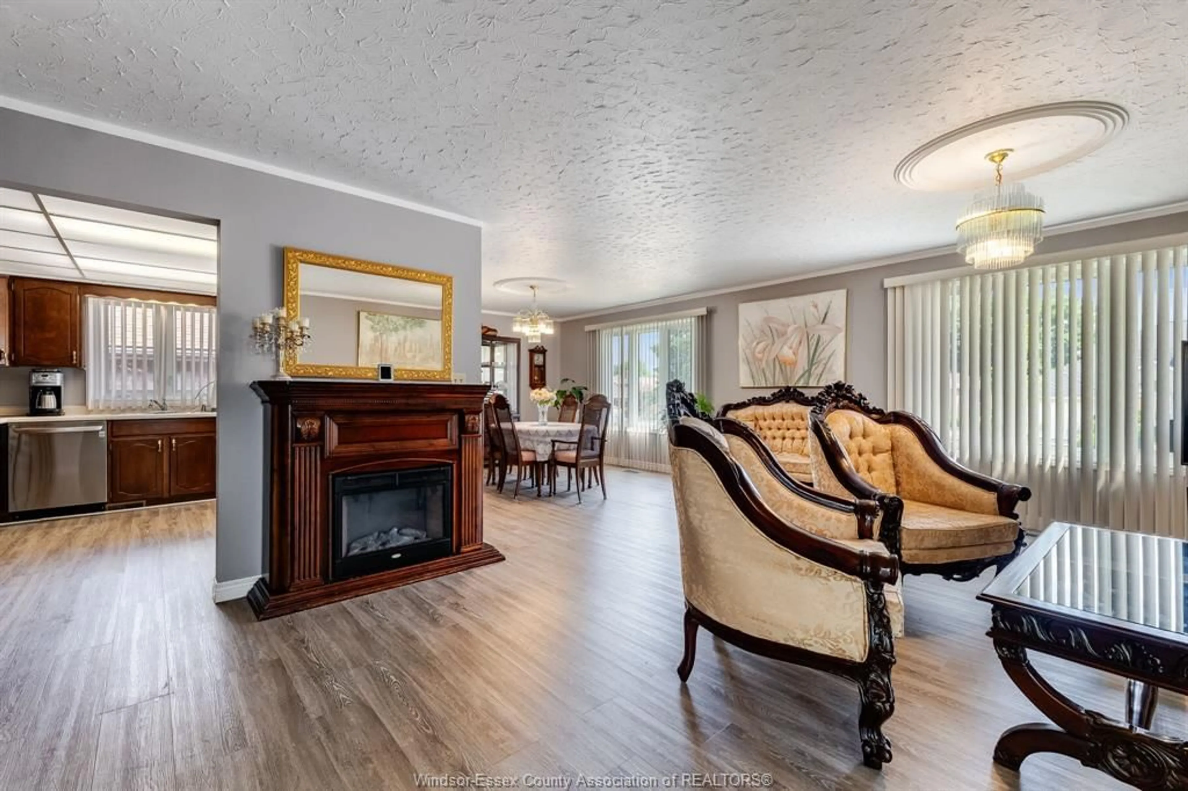 Living room with furniture, wood/laminate floor for 37 Elizabeth Cres, Leamington Ontario N8H 4Y4