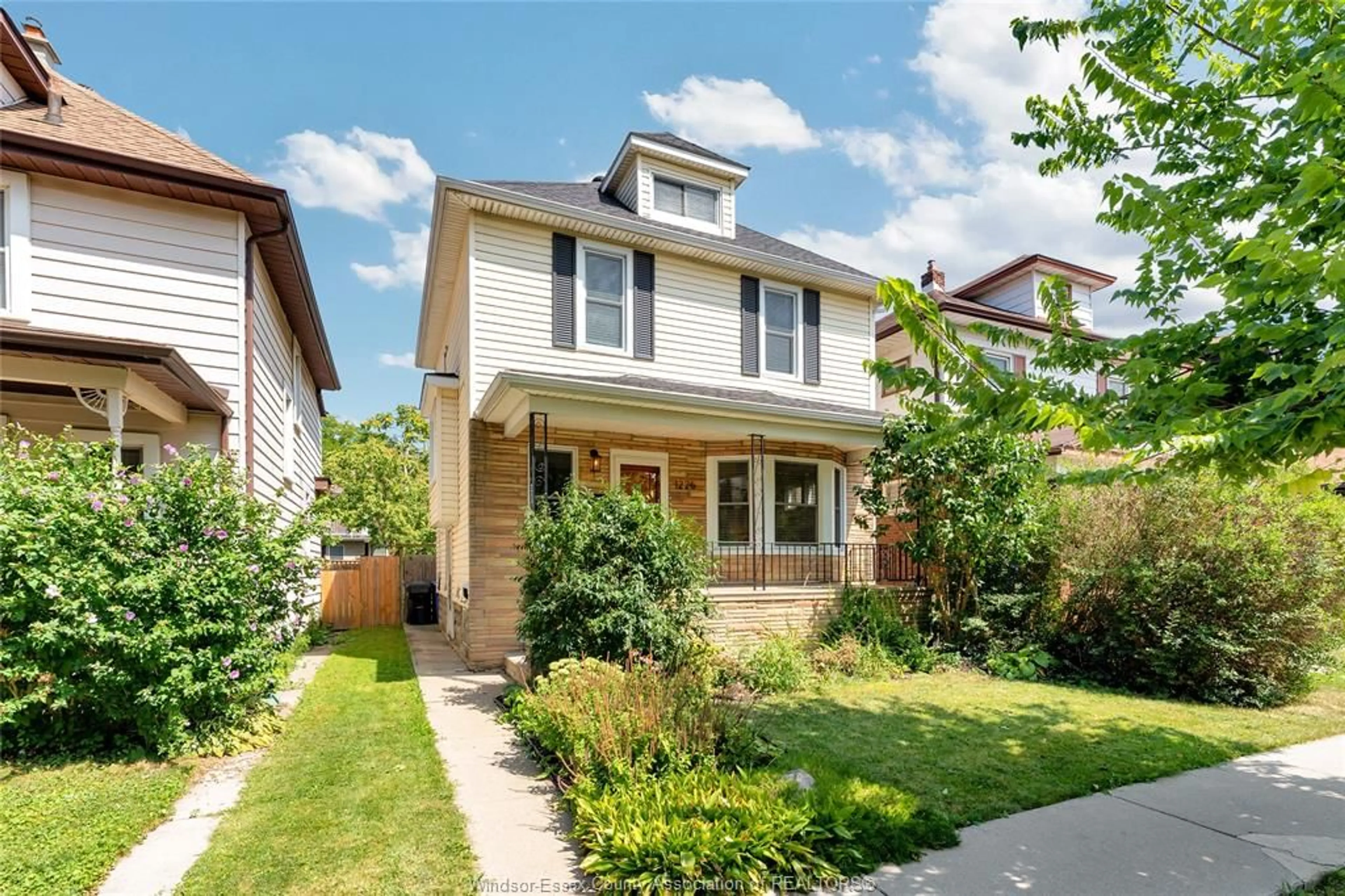 Home with brick exterior material, street for 1226 Windermere Rd, Windsor Ontario N8Y 3E8