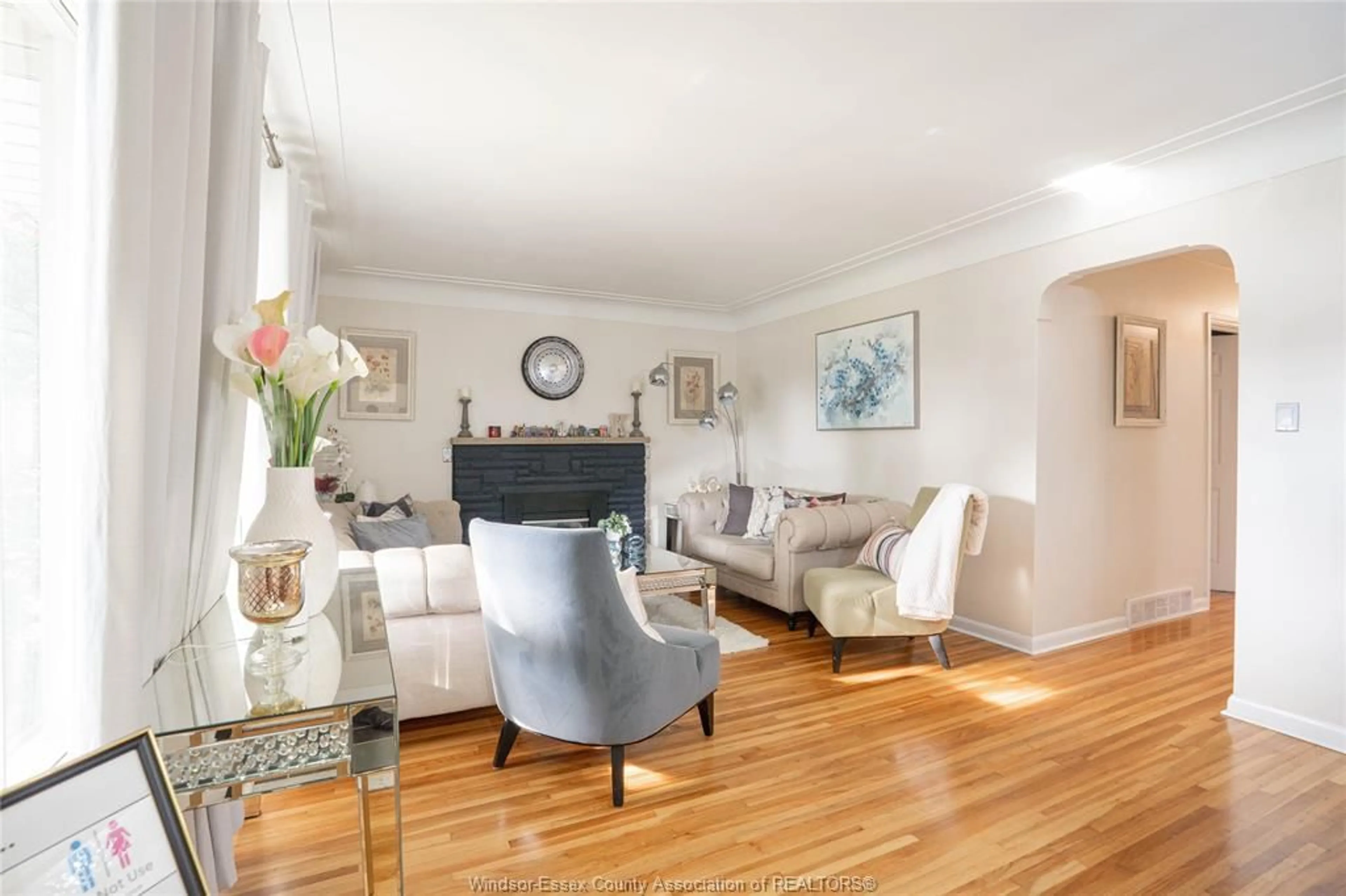Living room with furniture, wood/laminate floor for 2250 Woodlawn Ave, Windsor Ontario N8W 2H3