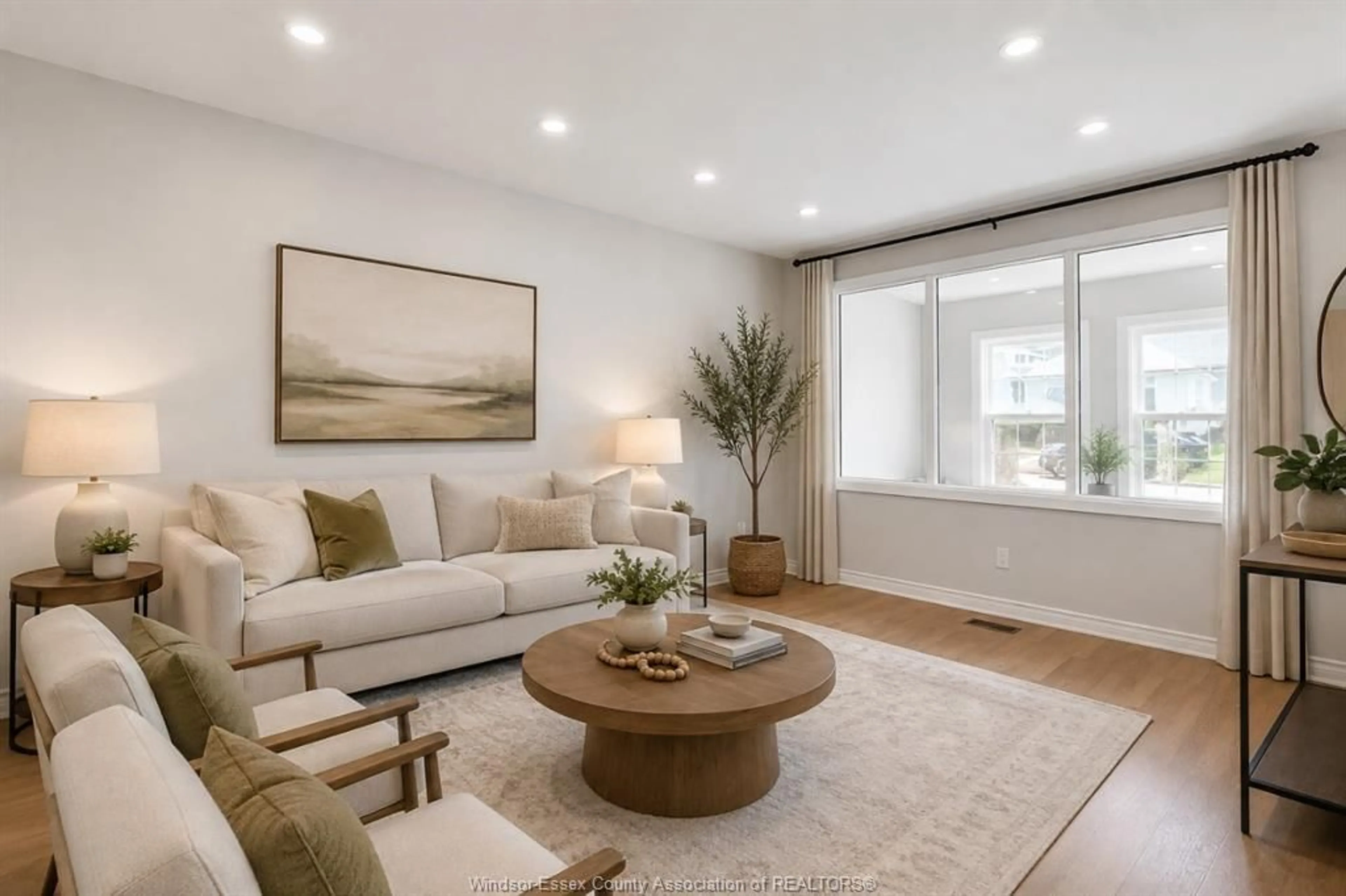 Living room with furniture, wood/laminate floor for 744 MCKAY Ave, Windsor Ontario N9B 2A1