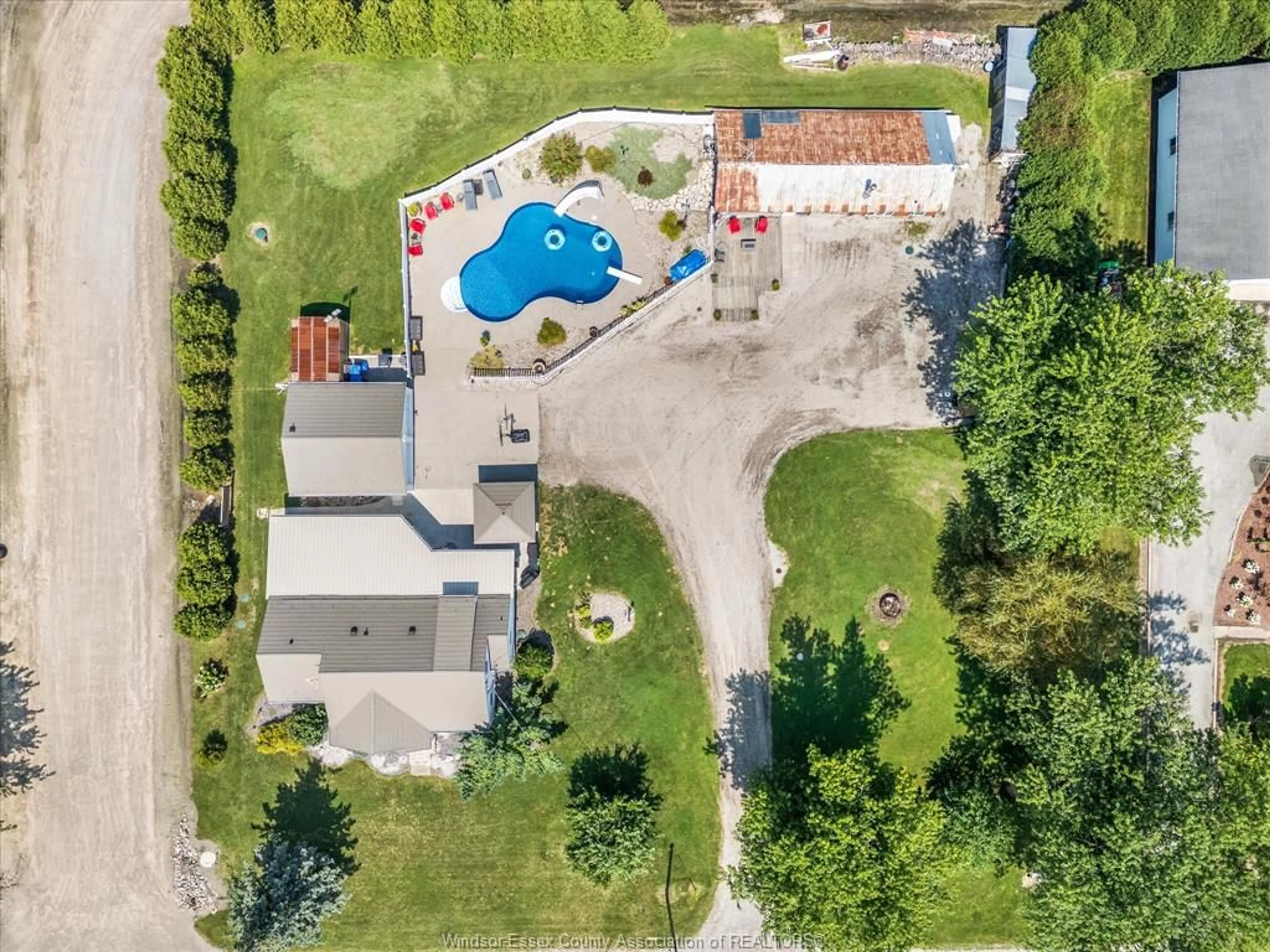 A pic from outside/outdoor area/front of a property/back of a property/a pic from drone, unknown for 343 County Rd 14, Cottam Ontario N0R 1B0