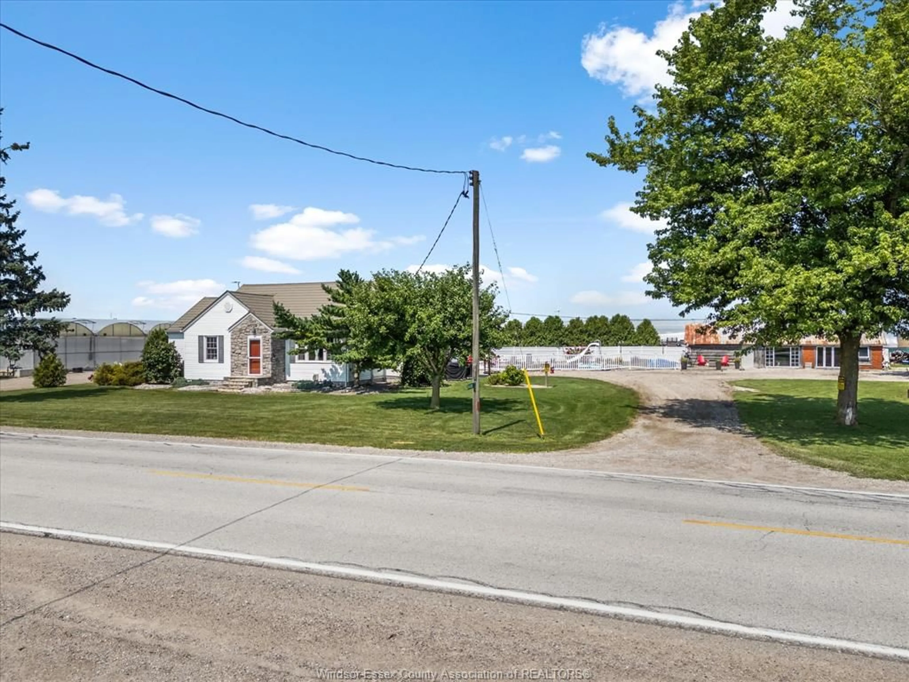 A pic from outside/outdoor area/front of a property/back of a property/a pic from drone, street for 343 County Rd 14, Cottam Ontario N0R 1B0