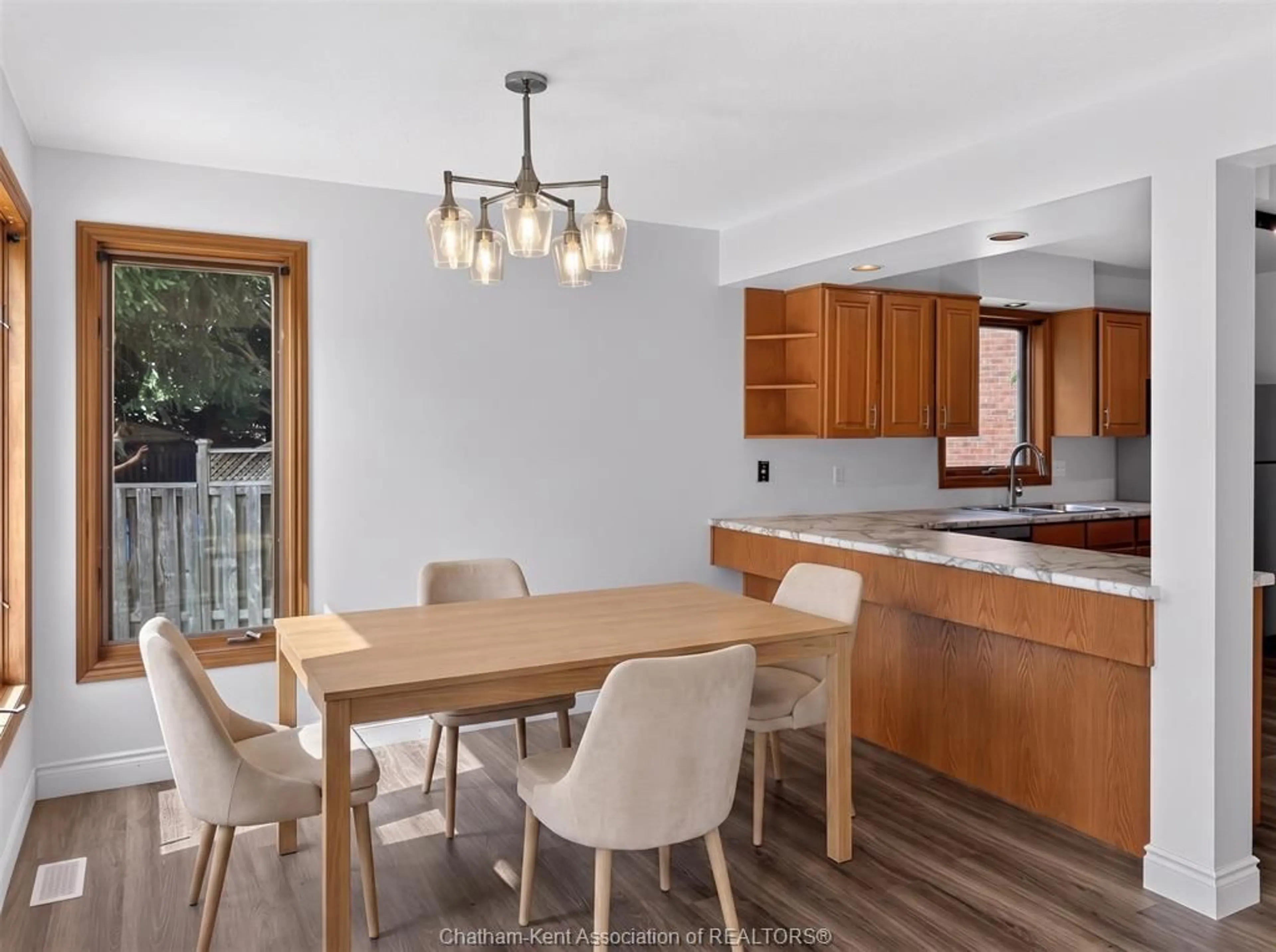 Open concept kitchen, wood/laminate floor for 102 NORTHERN PINE Pl, Chatham Ontario N7L 5K2