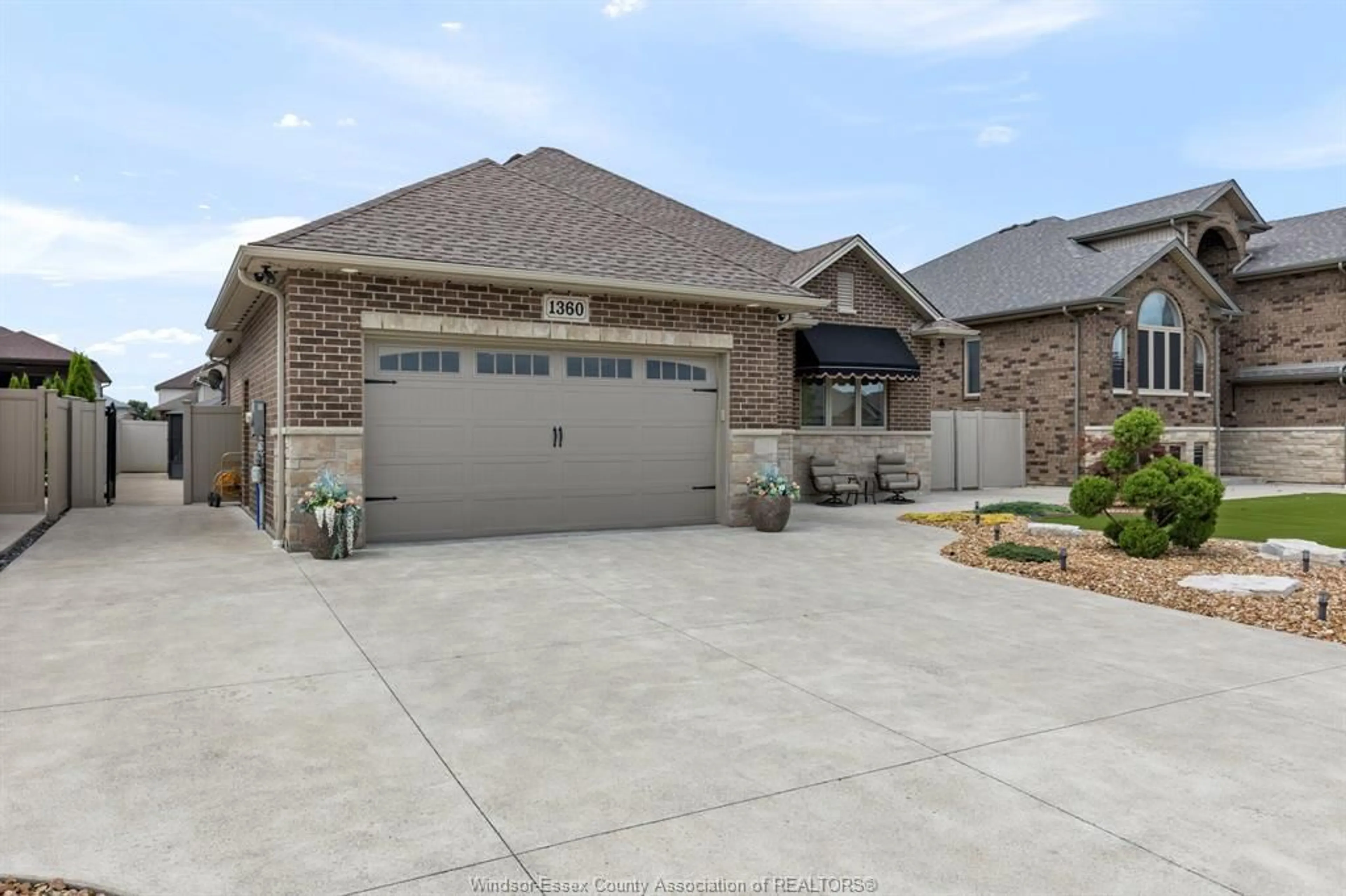 Home with brick exterior material, street for 1360 LEGENDS Lane, Lakeshore Ontario N8L 0T3