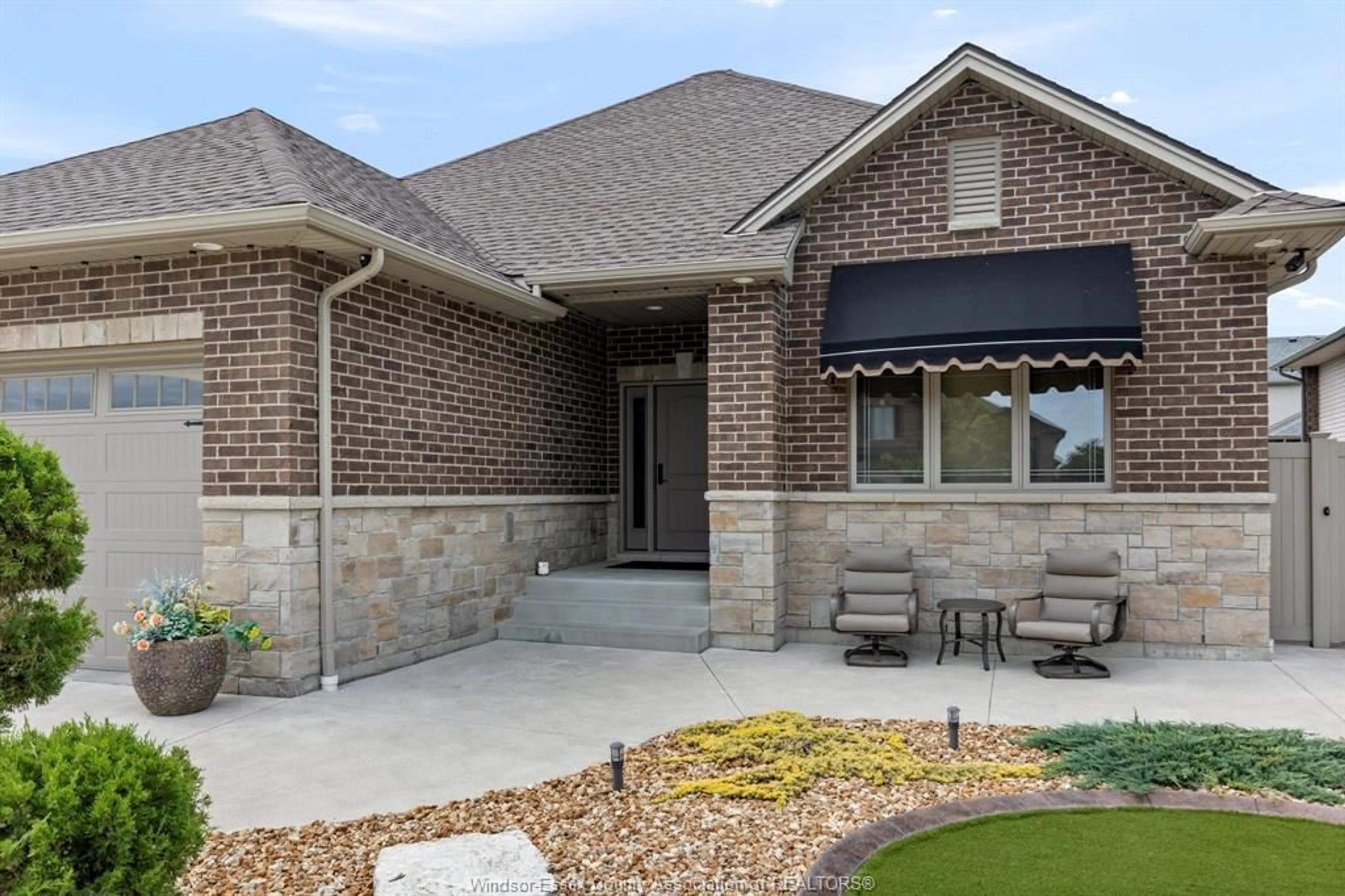 Home with brick exterior material, street for 1360 LEGENDS Lane, Lakeshore Ontario N8L 0T3