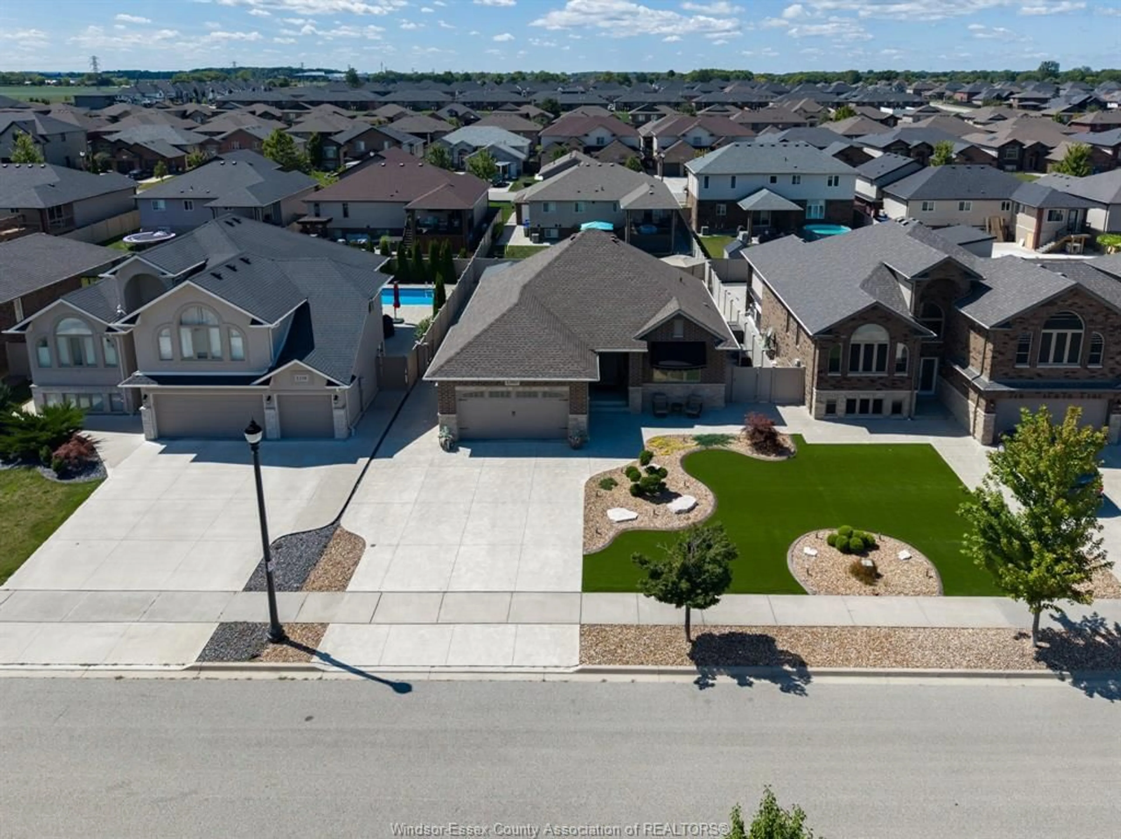 A pic from outside/outdoor area/front of a property/back of a property/a pic from drone, street for 1360 LEGENDS Lane, Lakeshore Ontario N8L 0T3