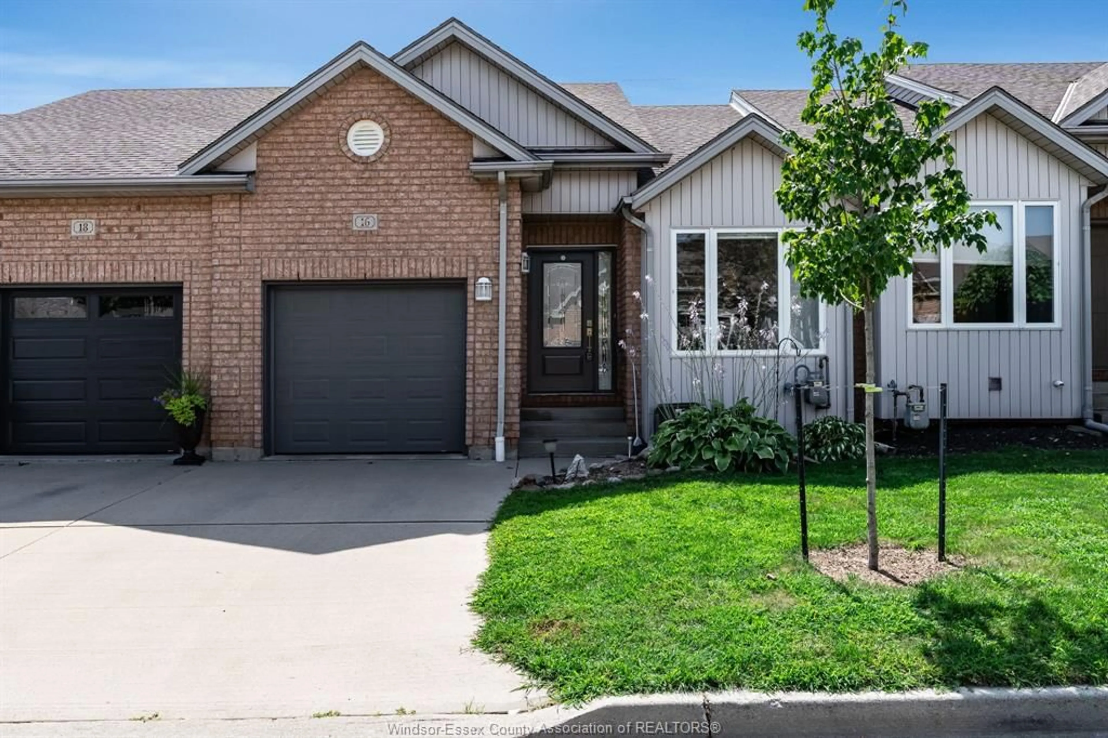 Home with brick exterior material, street for 16 Erie Glen Crescent, Leamington Ontario N8H 5K2