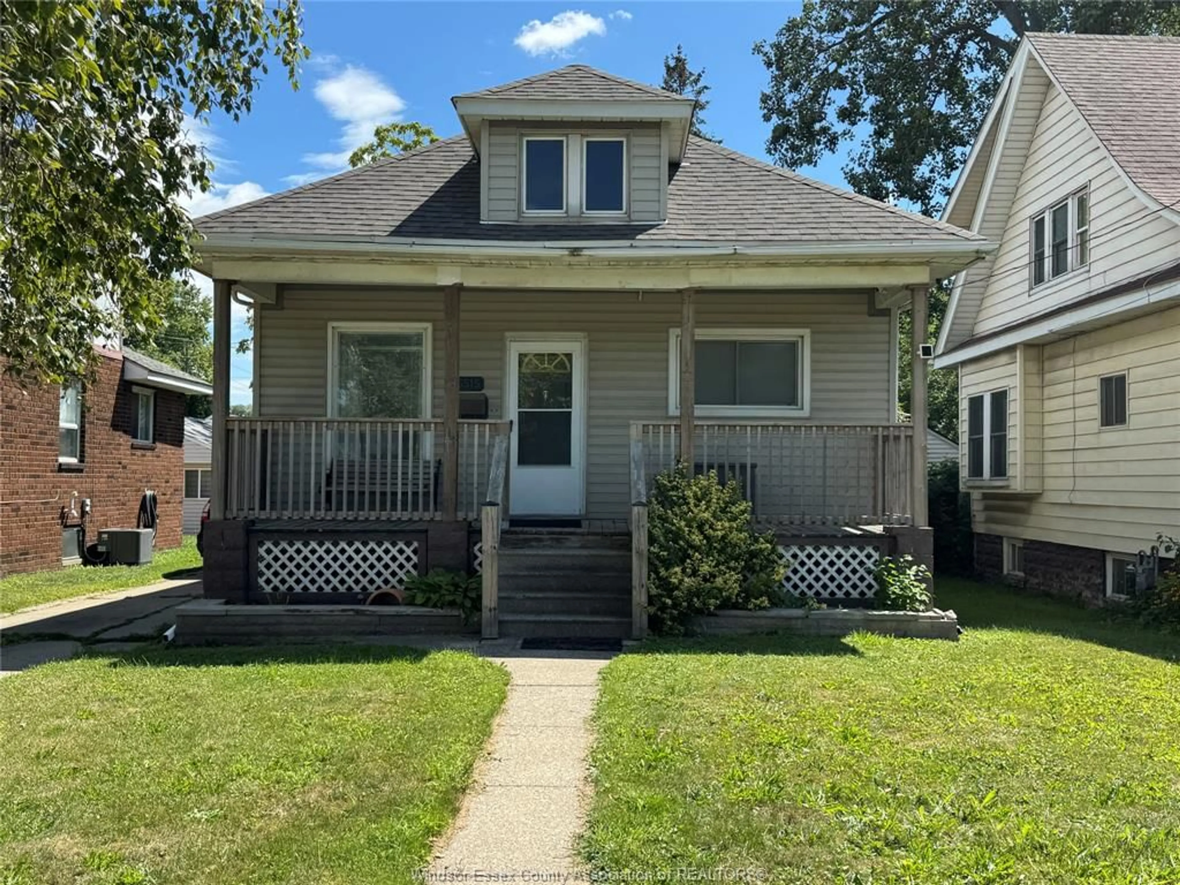 Home with vinyl exterior material, street for 3515 SANDWICH St, Windsor Ontario N9C 1B6