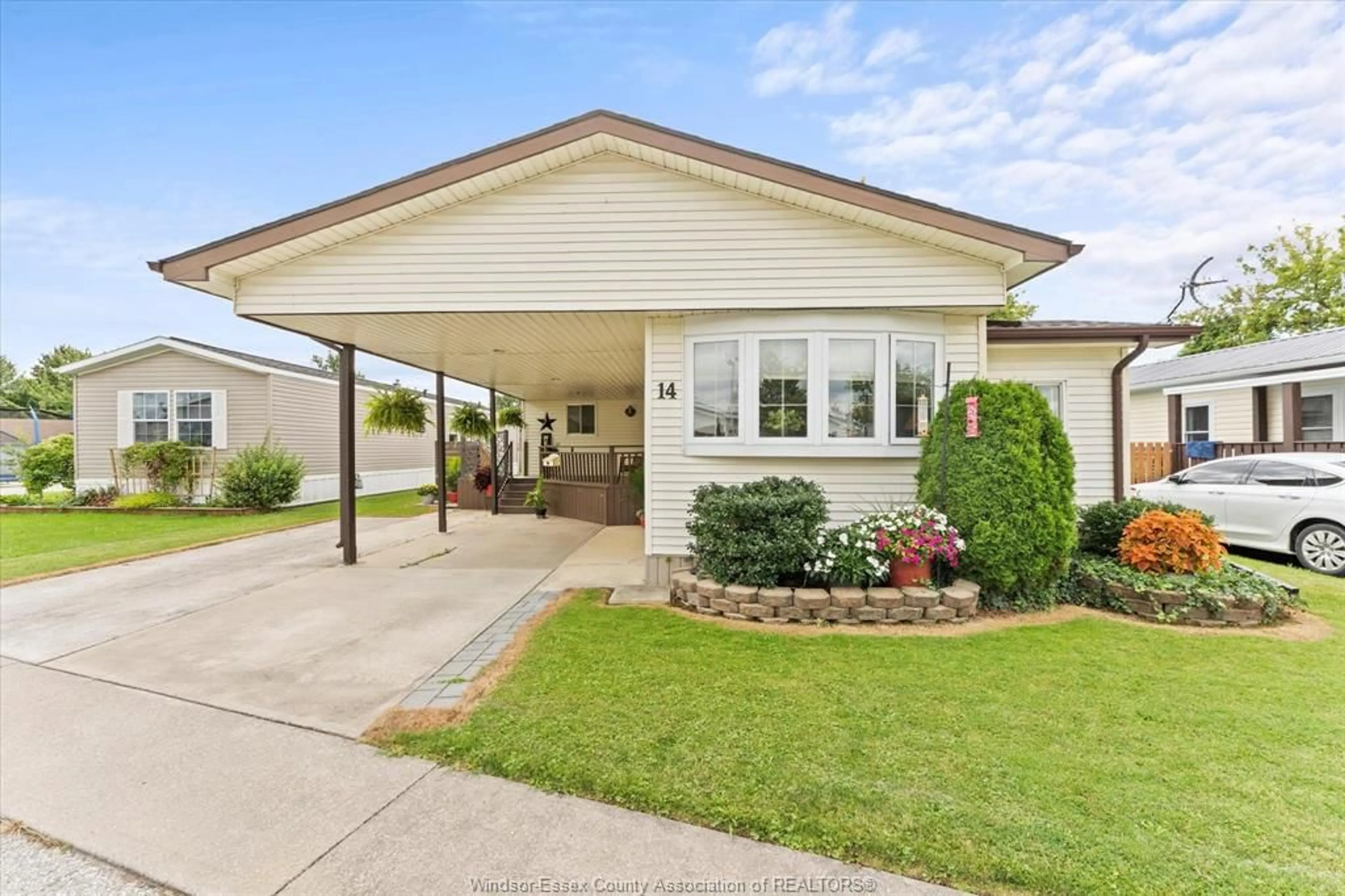 Home with vinyl exterior material, street for 14 CEDAR Cres, McGregor Ontario N0R 1J0