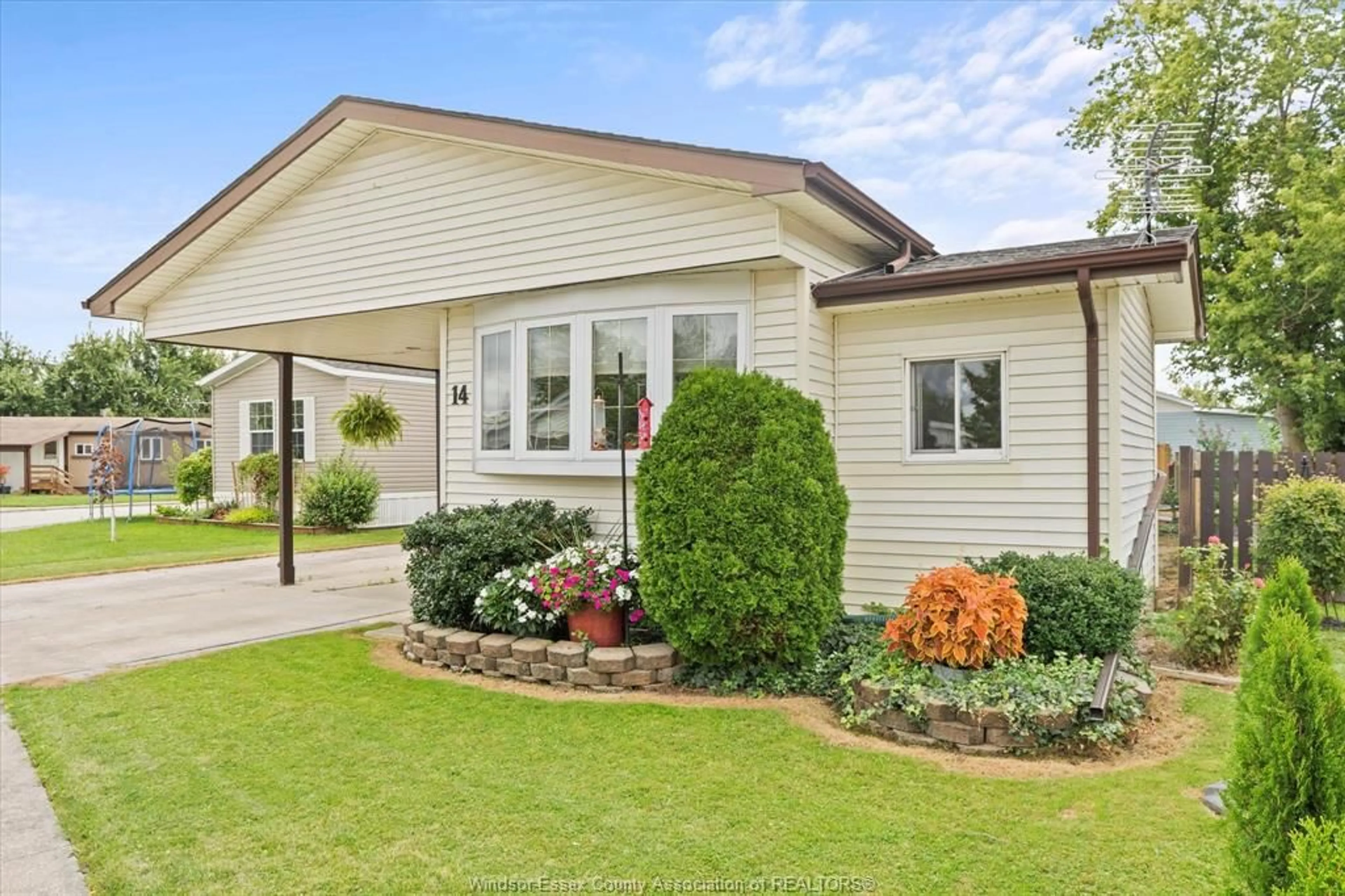 Home with vinyl exterior material, street for 14 CEDAR Cres, McGregor Ontario N0R 1J0