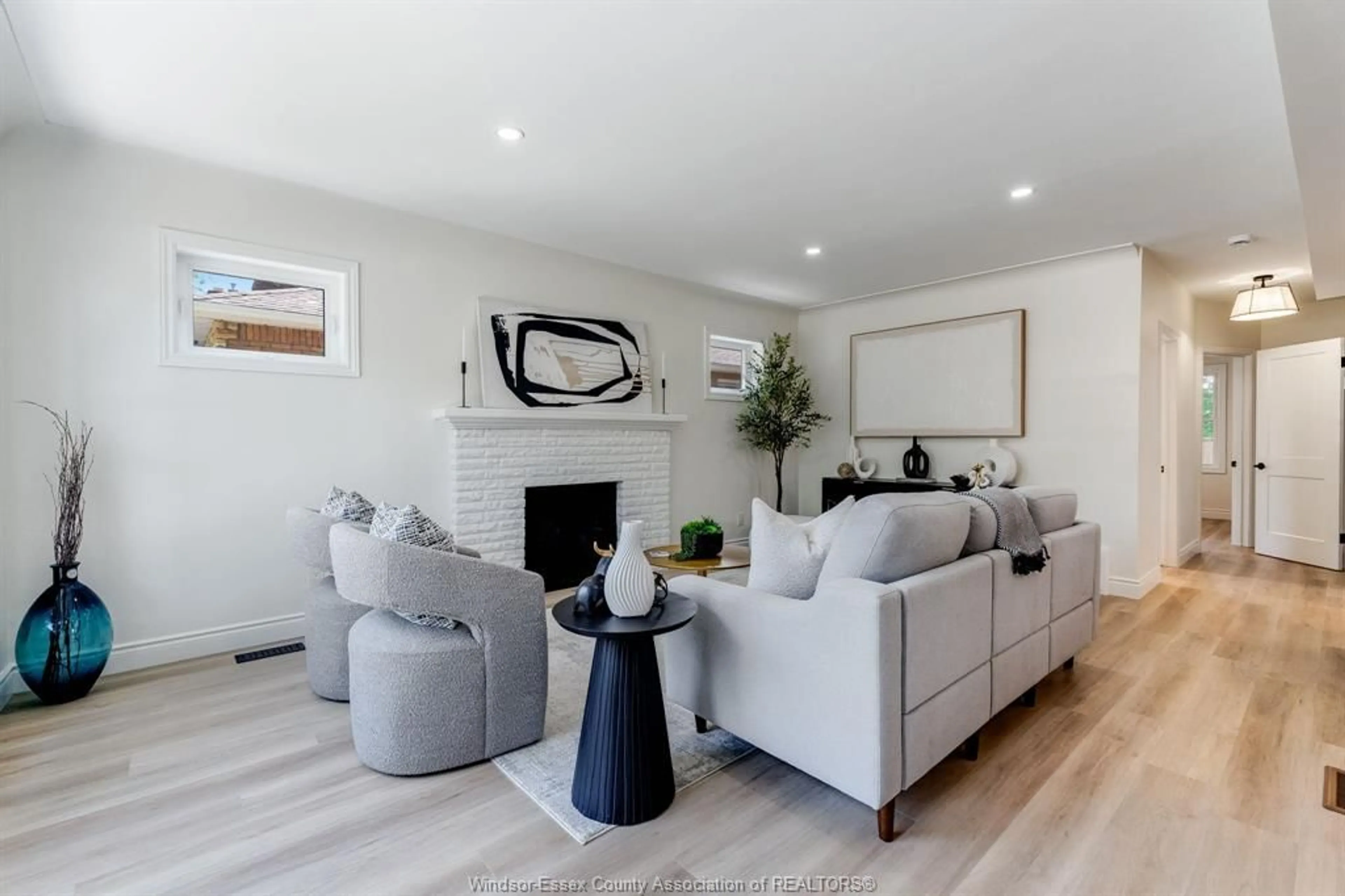 Living room with furniture, wood/laminate floor for 2309 Hall, Windsor Ontario N8W 2M1