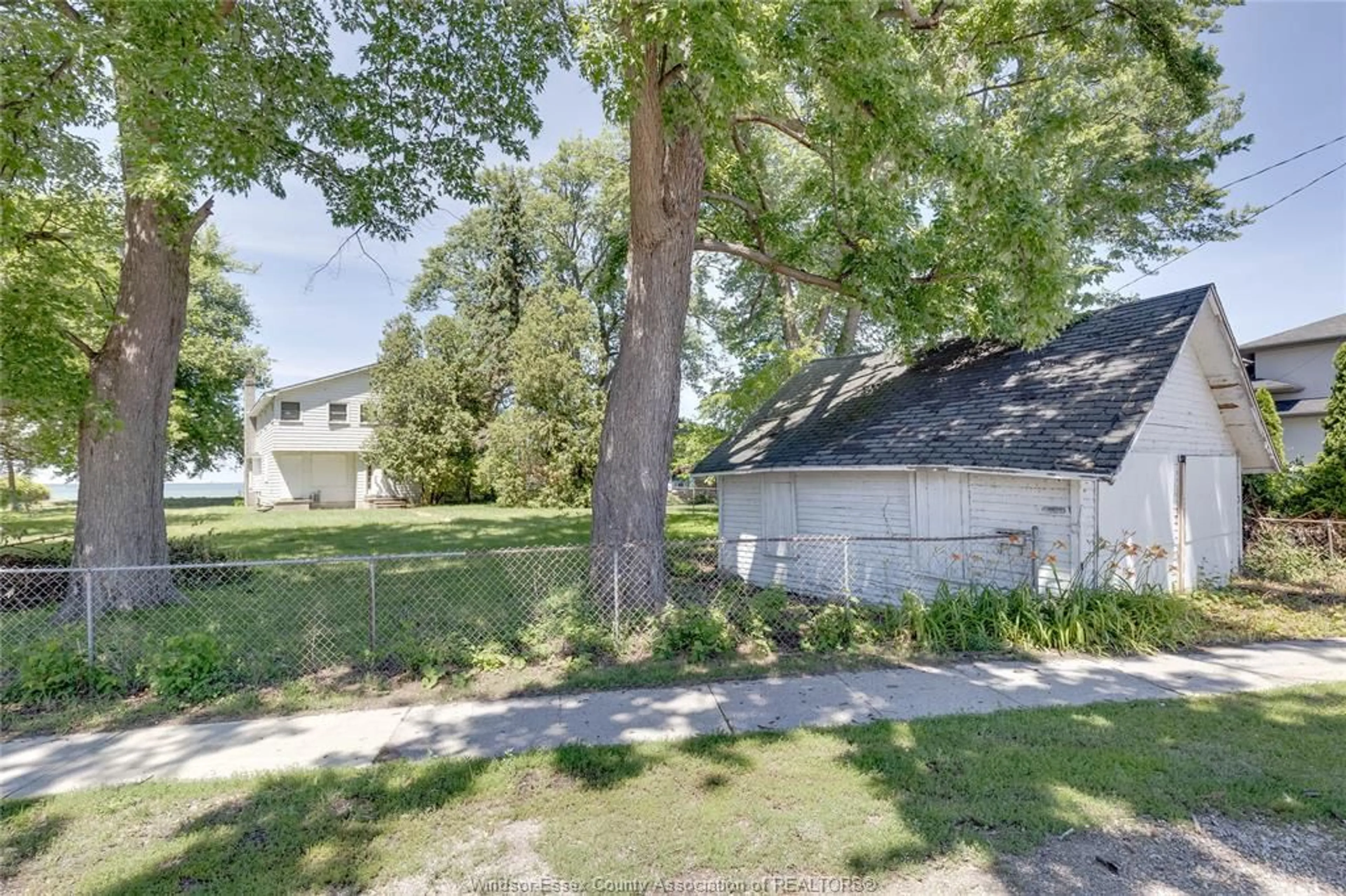 A pic from outside/outdoor area/front of a property/back of a property/a pic from drone, street for 13110 RIVERSIDE Dr, Tecumseh Ontario N8N 2M6