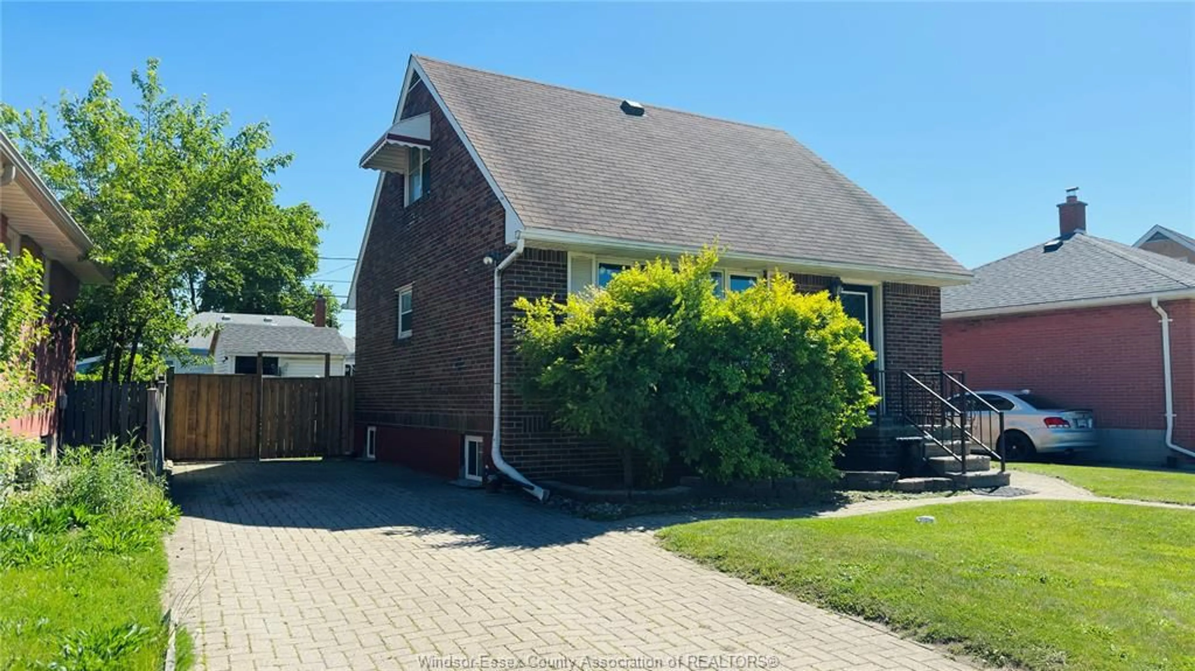 Home with brick exterior material, street for 3519 TECUMSEH Rd, Windsor Ontario N9C 2B6