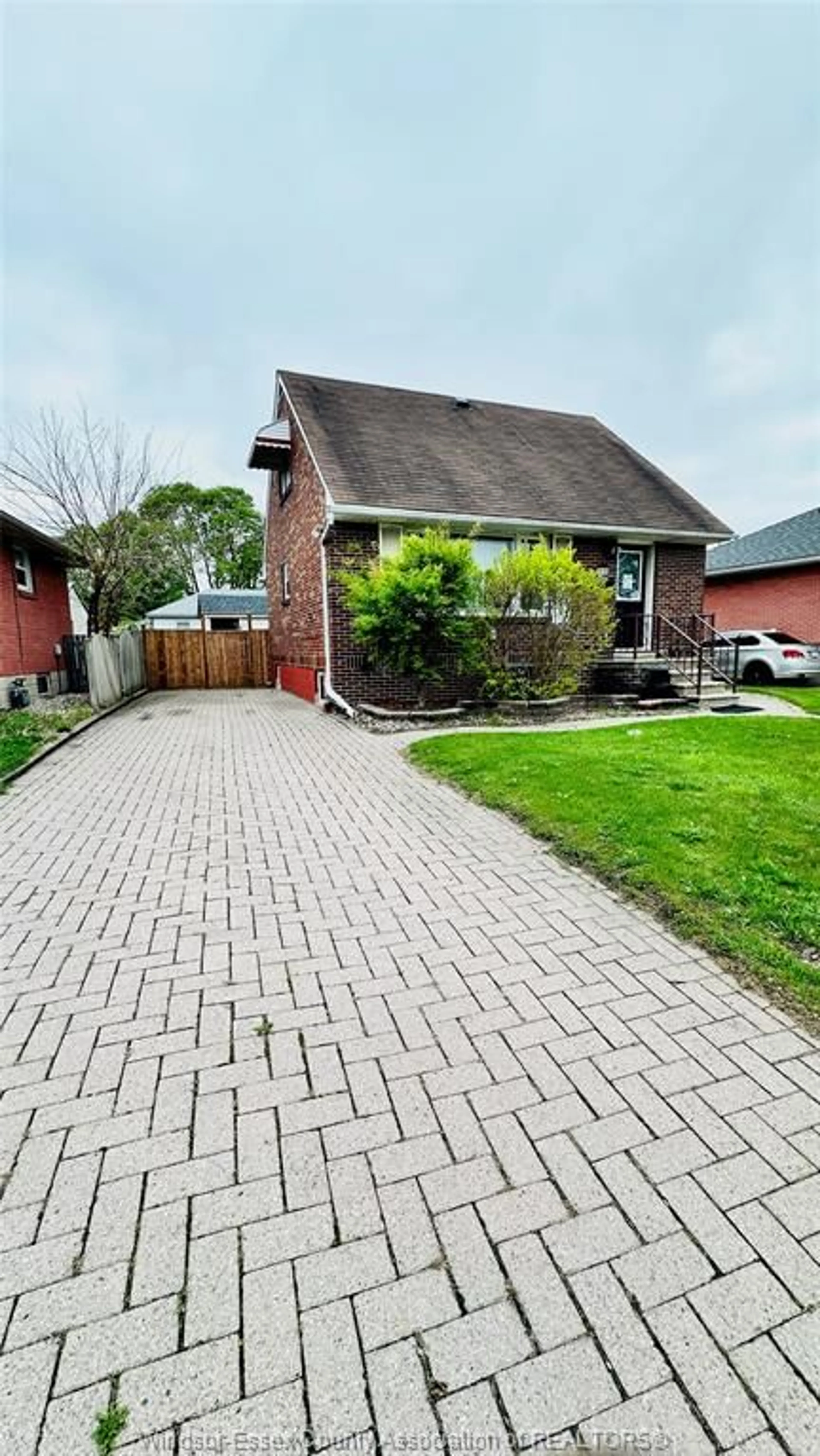 A pic from outside/outdoor area/front of a property/back of a property/a pic from drone, street for 3519 TECUMSEH Rd, Windsor Ontario N9C 2B6