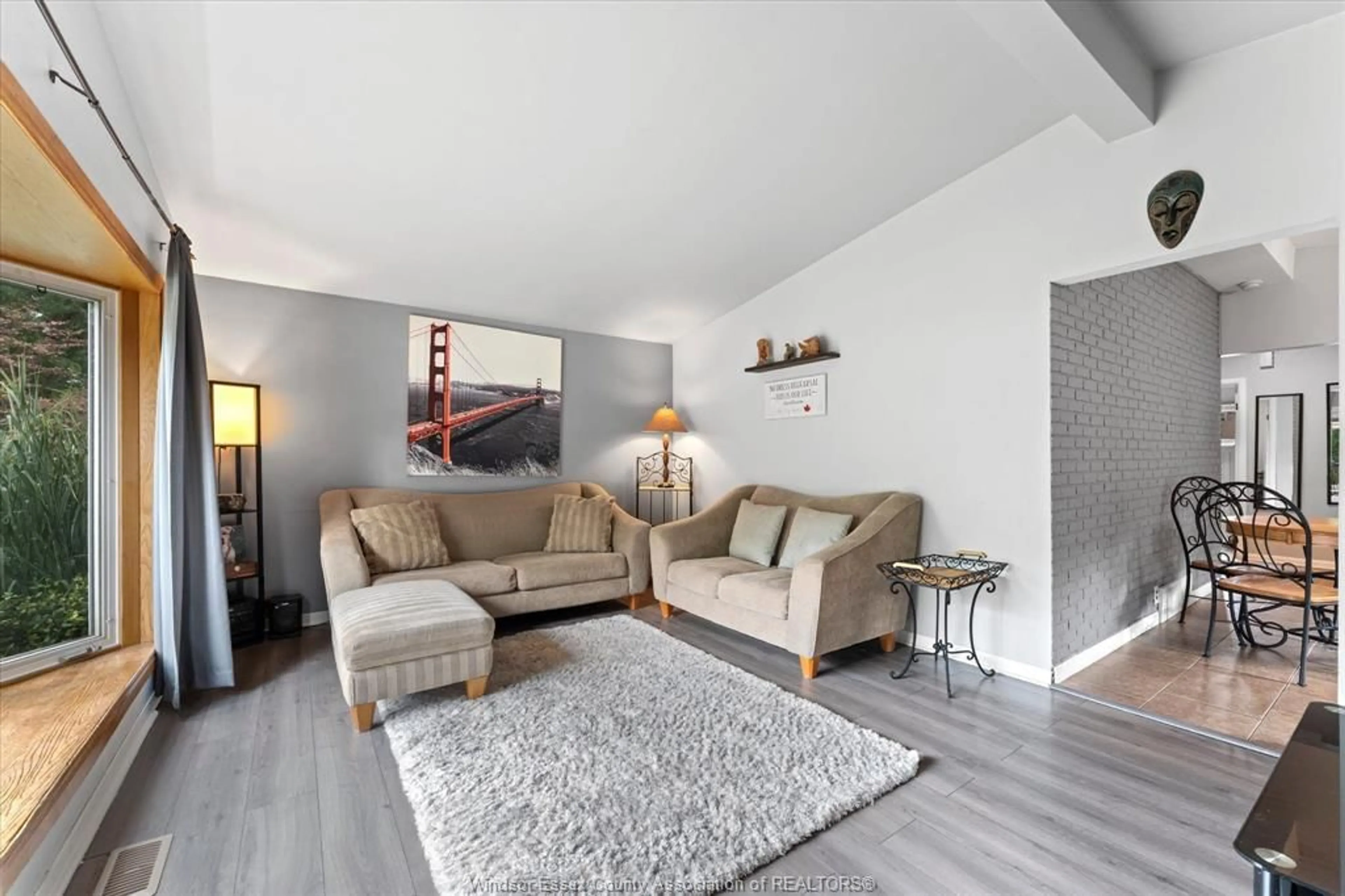 Living room with furniture, wood/laminate floor for 1714 SUN VALLEY Dr, Windsor Ontario N9C 3R2