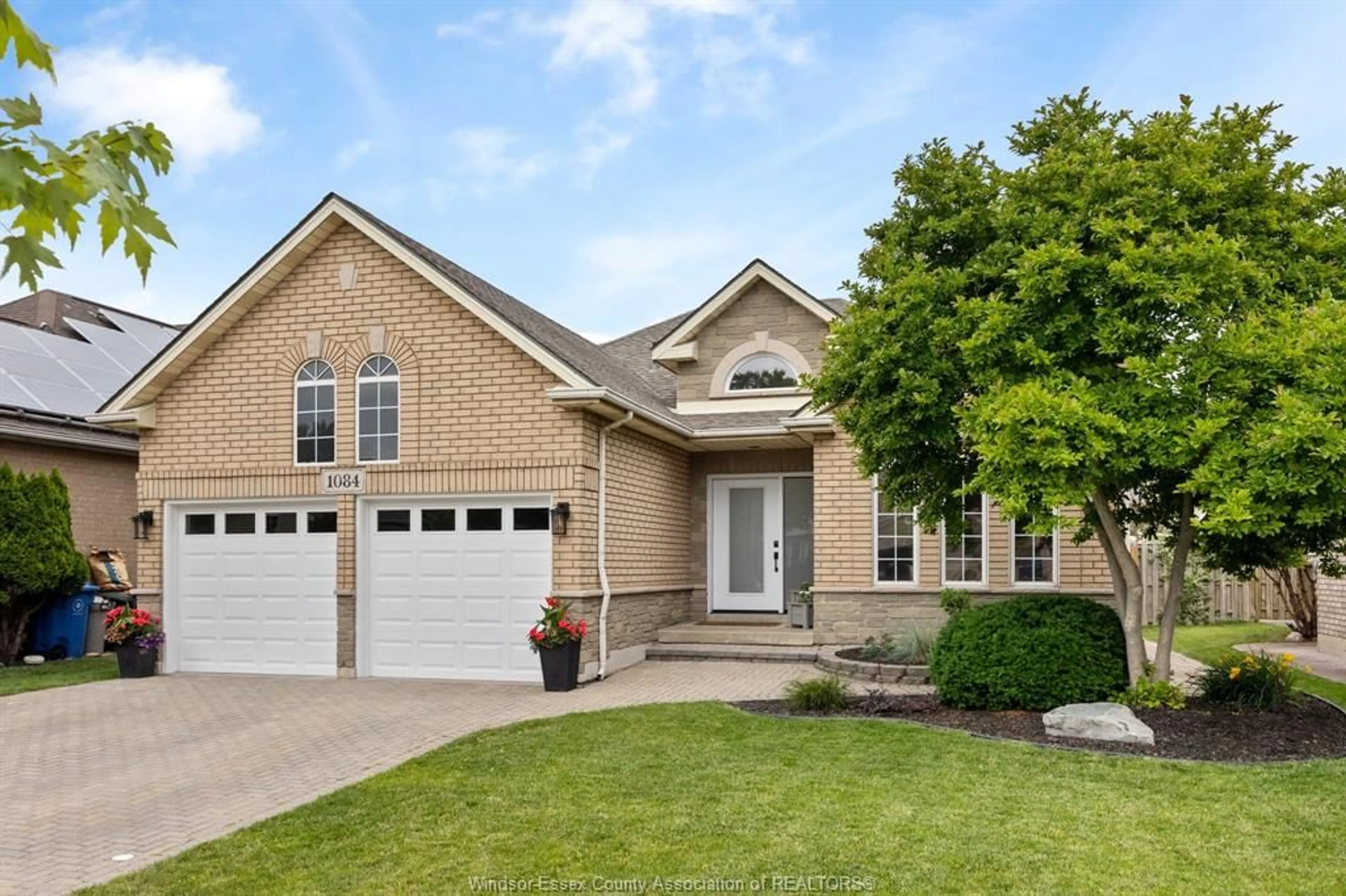 Home with brick exterior material, street for 1084 CORA GREENWOOD Dr, Windsor Ontario N8P 1K3