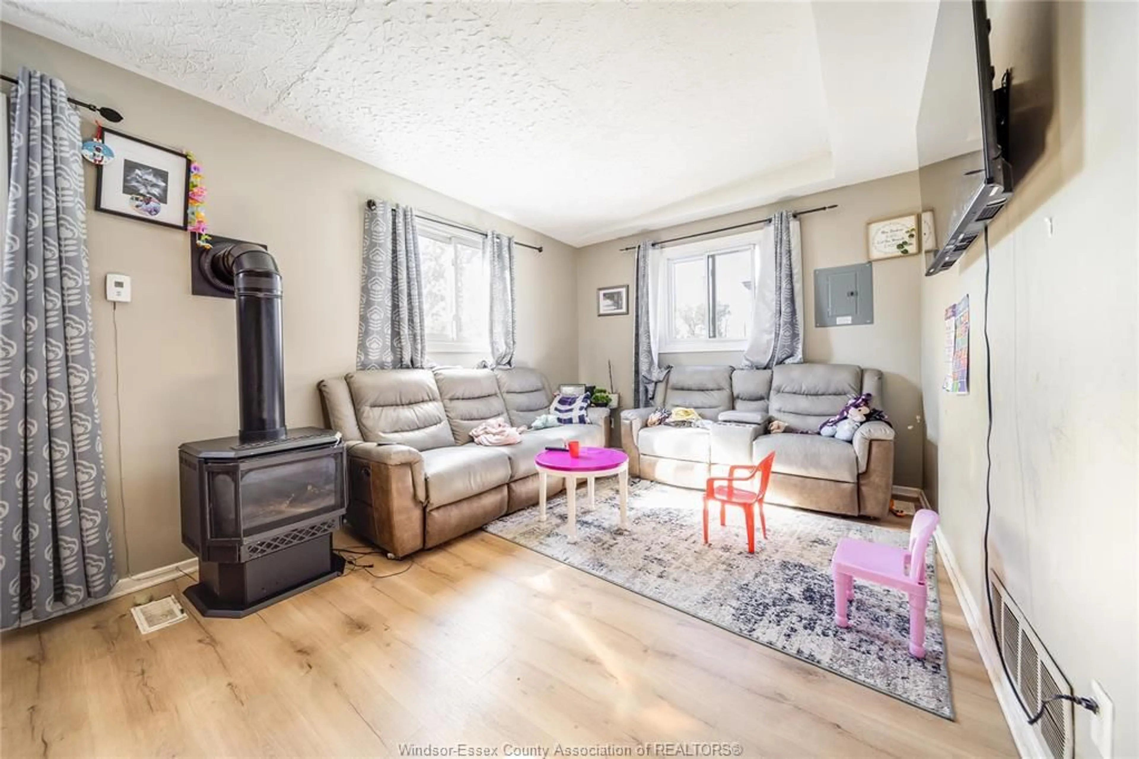Living room with furniture, wood/laminate floor for 1249 MARENTETTE Ave, Windsor Ontario N8X 4C7