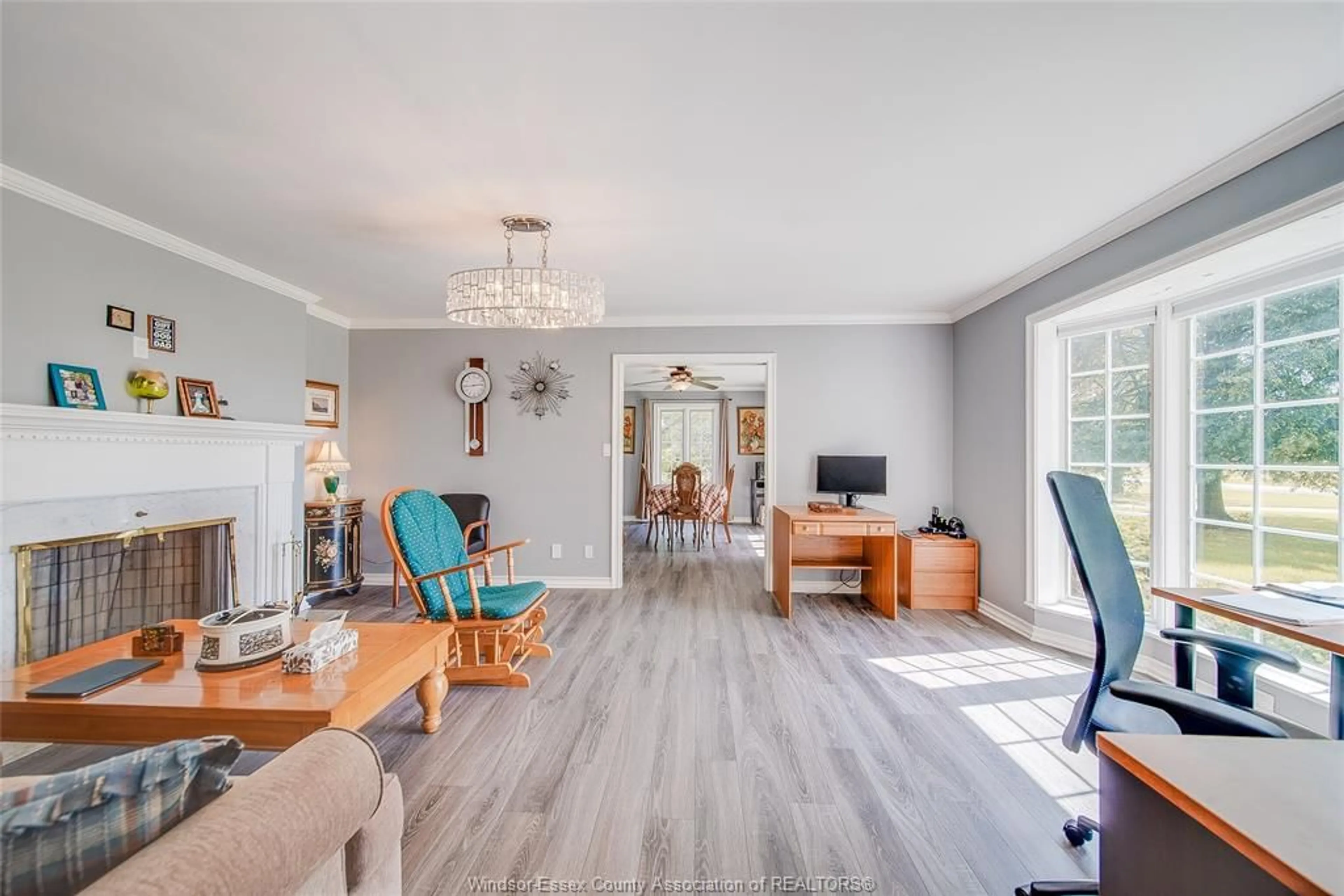 Living room with furniture, wood/laminate floor for 21109 DUART Rd, Muirkirk Ontario N0L 1X0