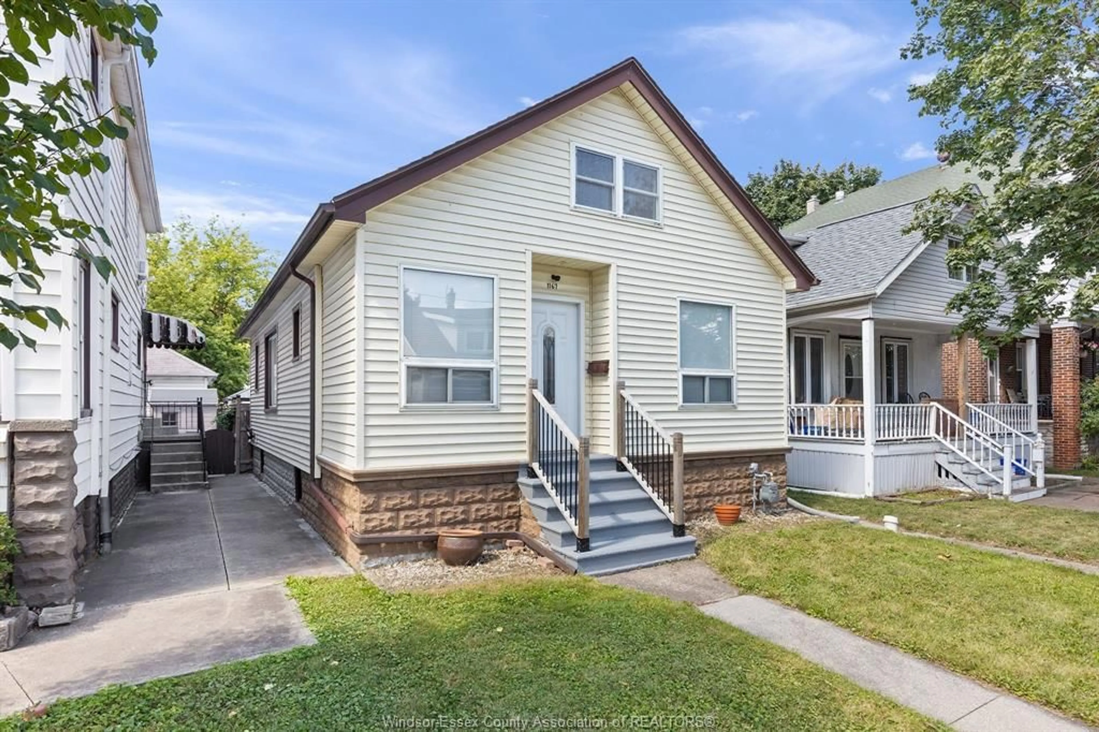 Home with vinyl exterior material, street for 1167 PIERRE Ave, Windsor Ontario N9A 2L3