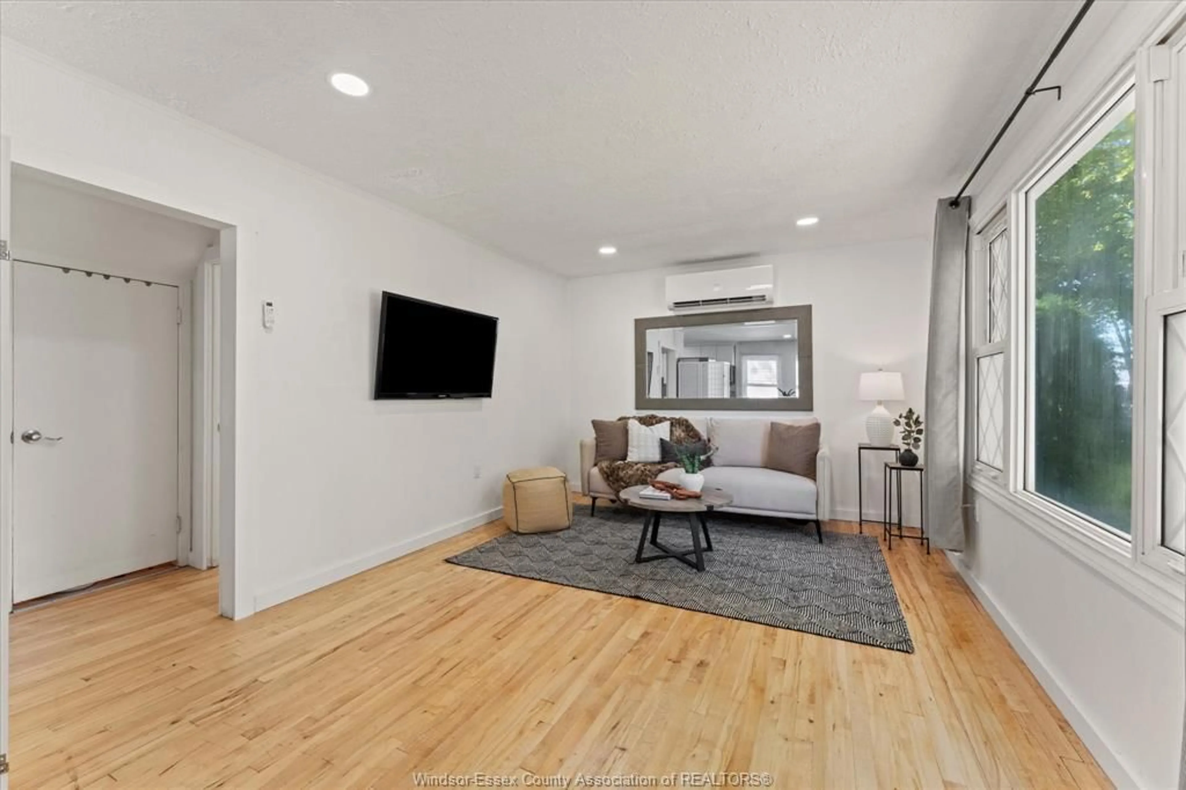 Living room with furniture, wood/laminate floor for 1336 PARTINGTON, Windsor Ontario N9B 2P6