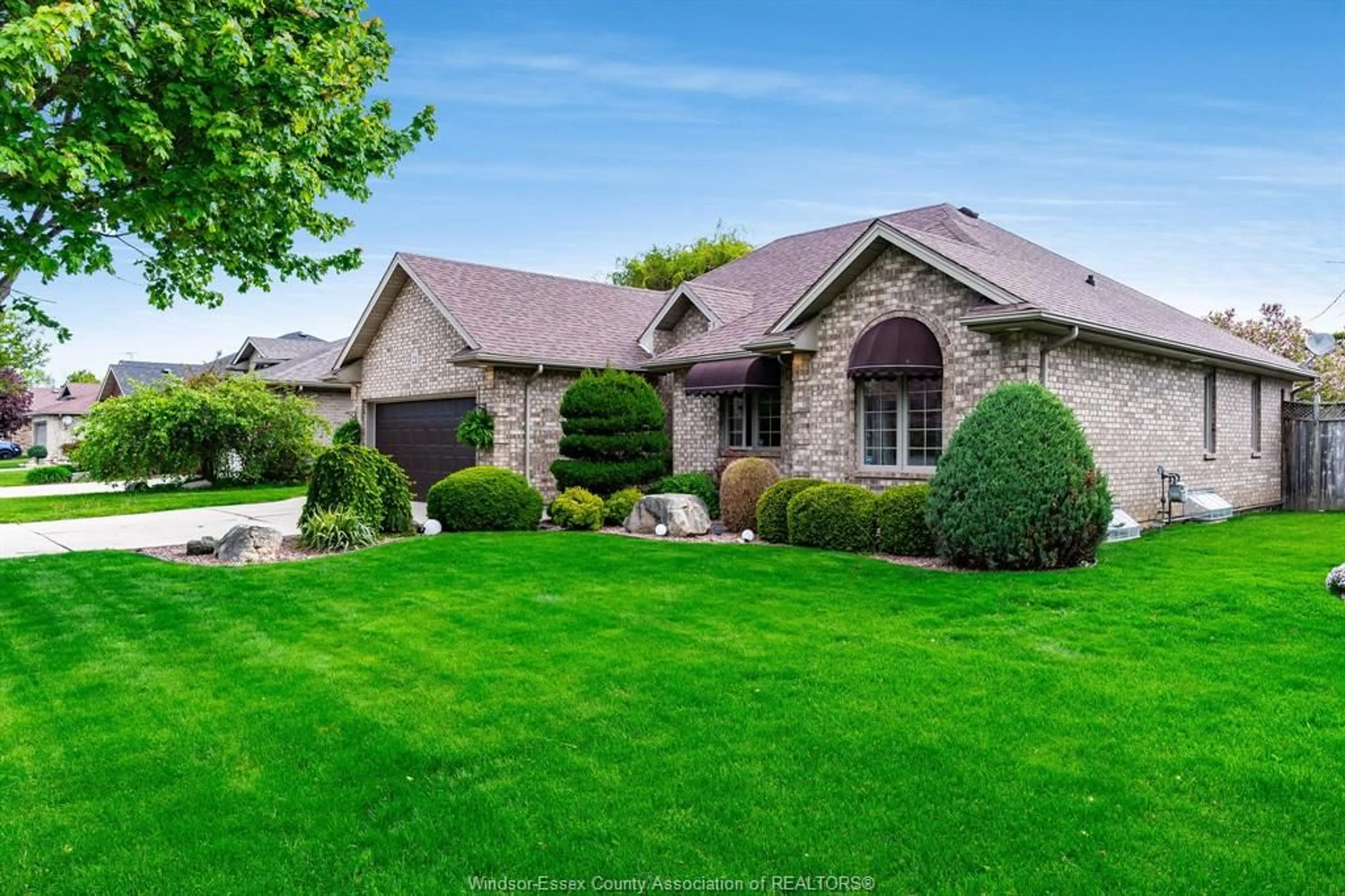 Home with brick exterior material, street for 21 Conservation Blvd, Kingsville Ontario N9Y 4E4