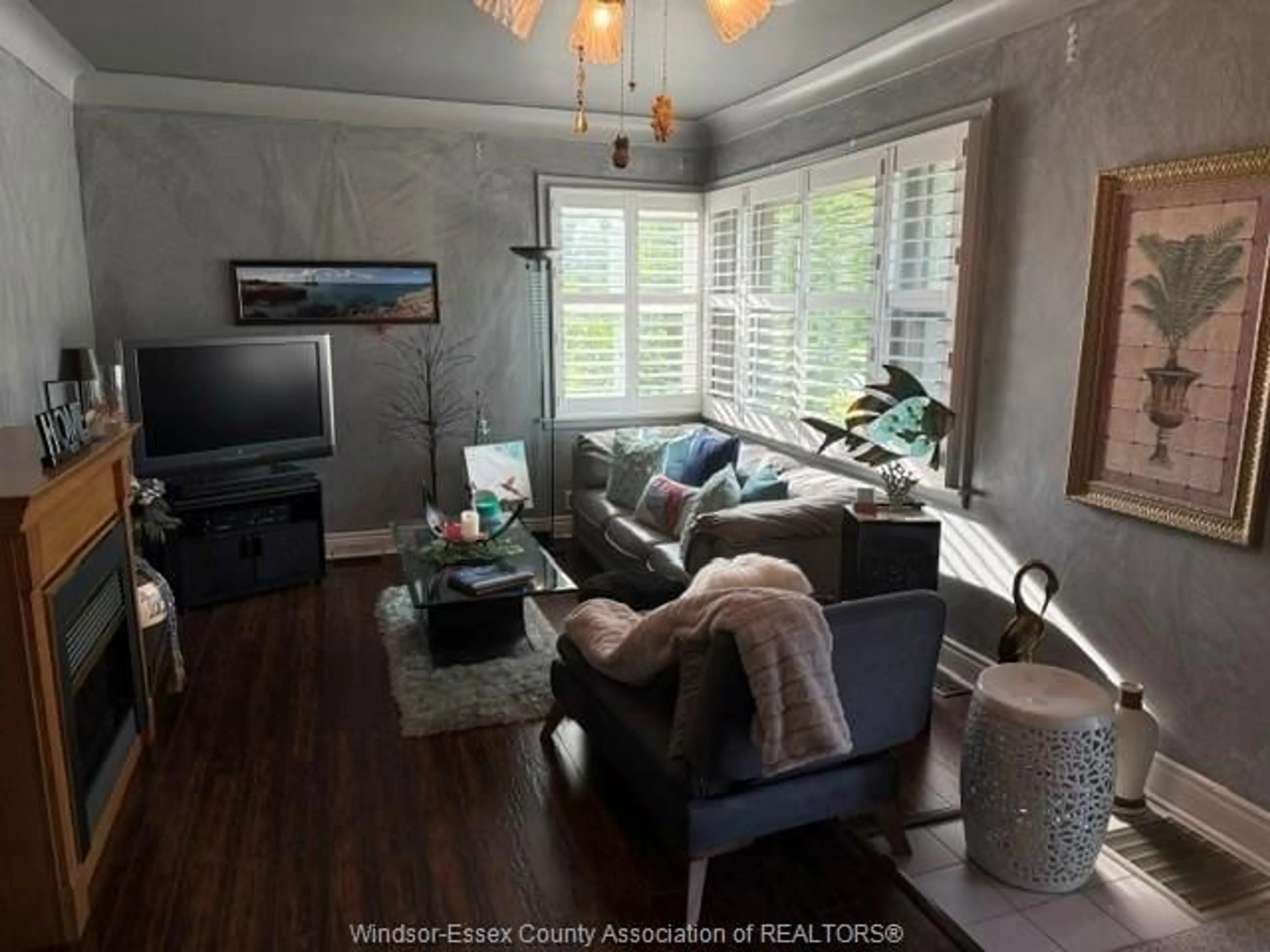 Living room with furniture, wood/laminate floor for 2115 TODD Lane, LaSalle Ontario N9H 1L6