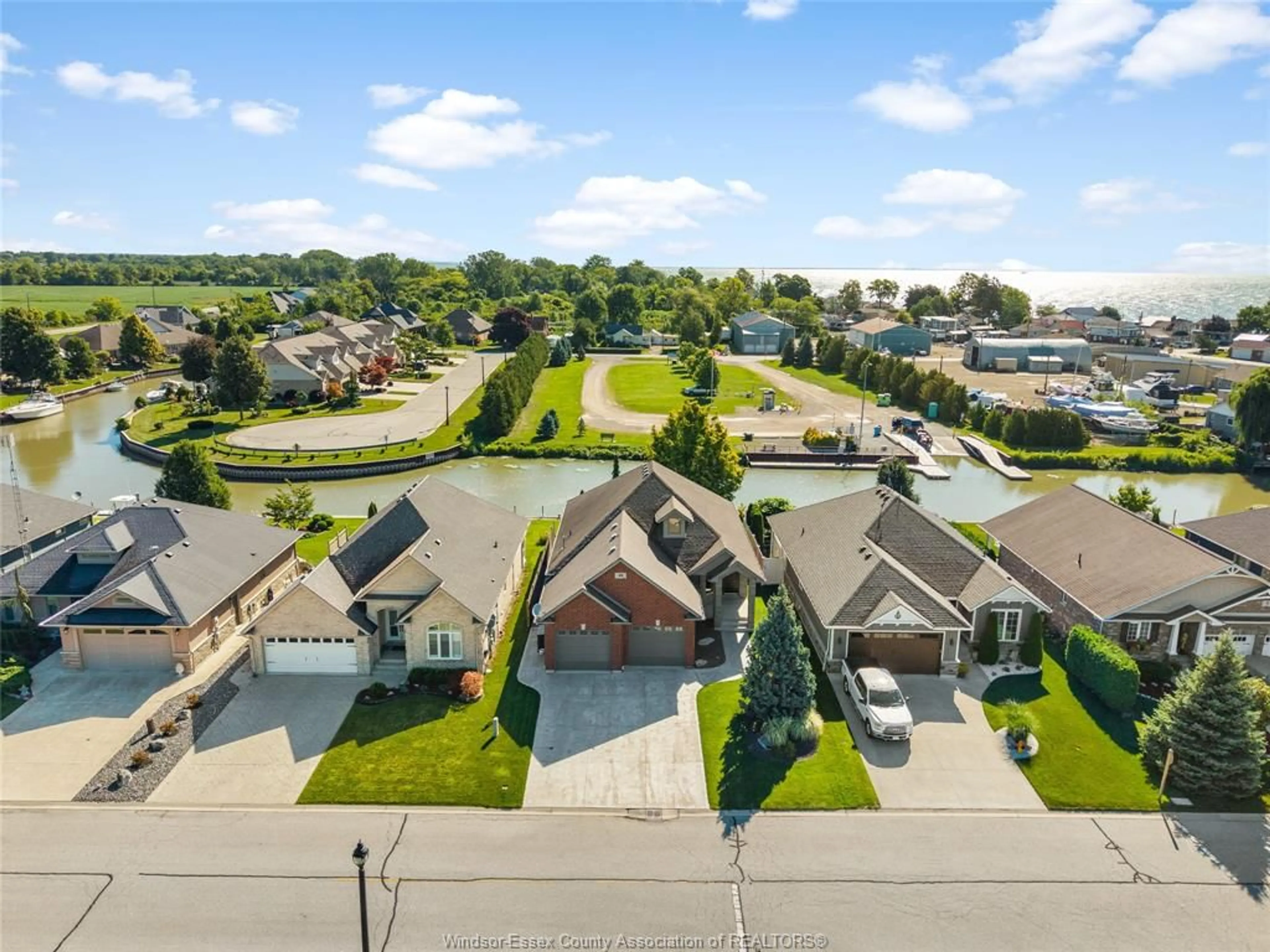 A pic from outside/outdoor area/front of a property/back of a property/a pic from drone, street for 49 Montego Bay Cres, Kingsville Ontario N9Y 4E7
